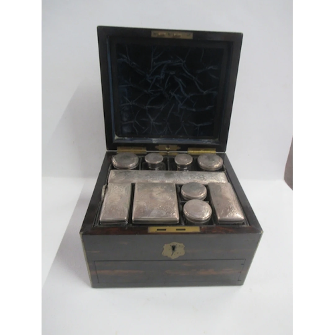 A Victorian coromandel wood vanity case, the interior fitted...