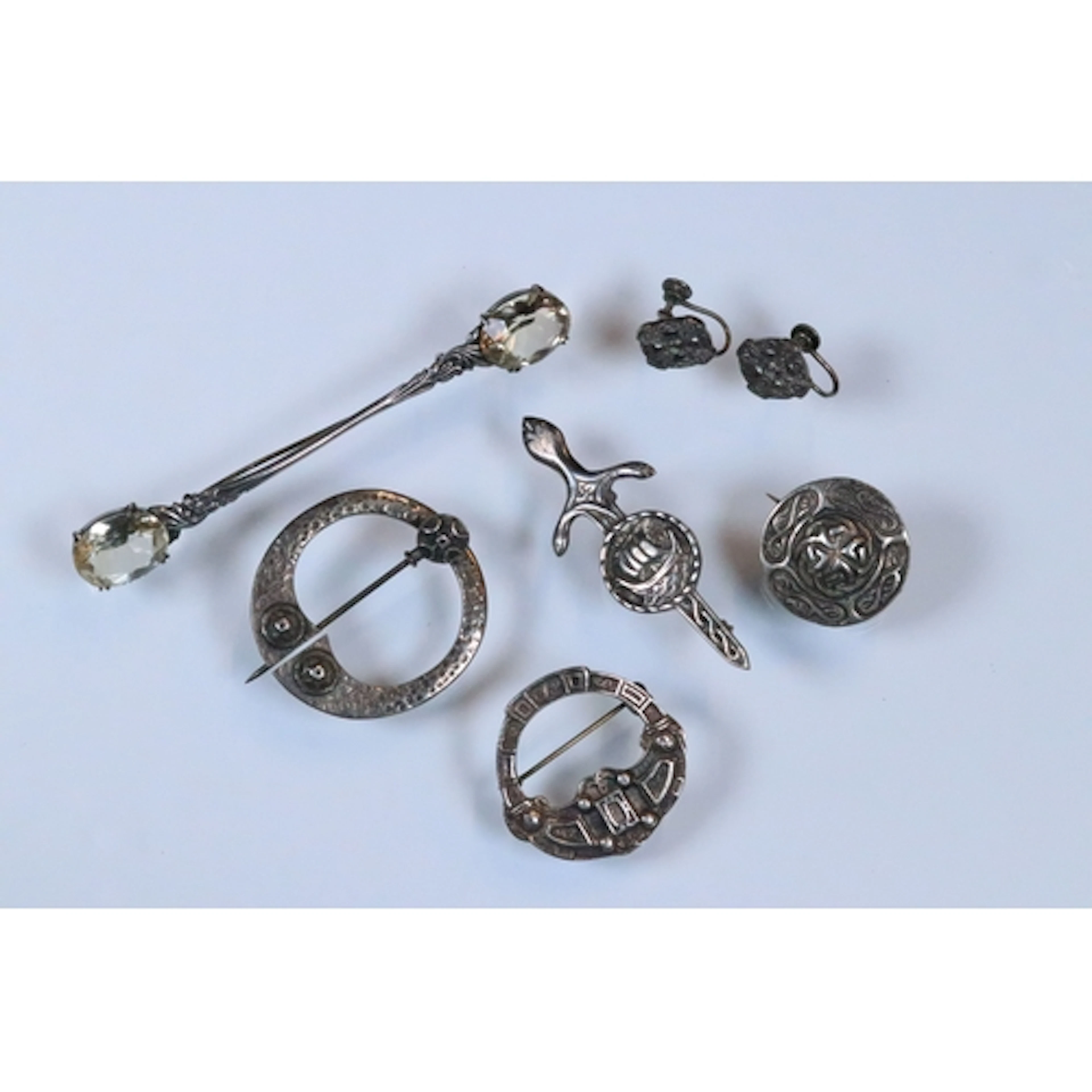 Group of silver Scottish style brooches to include a cloak b...