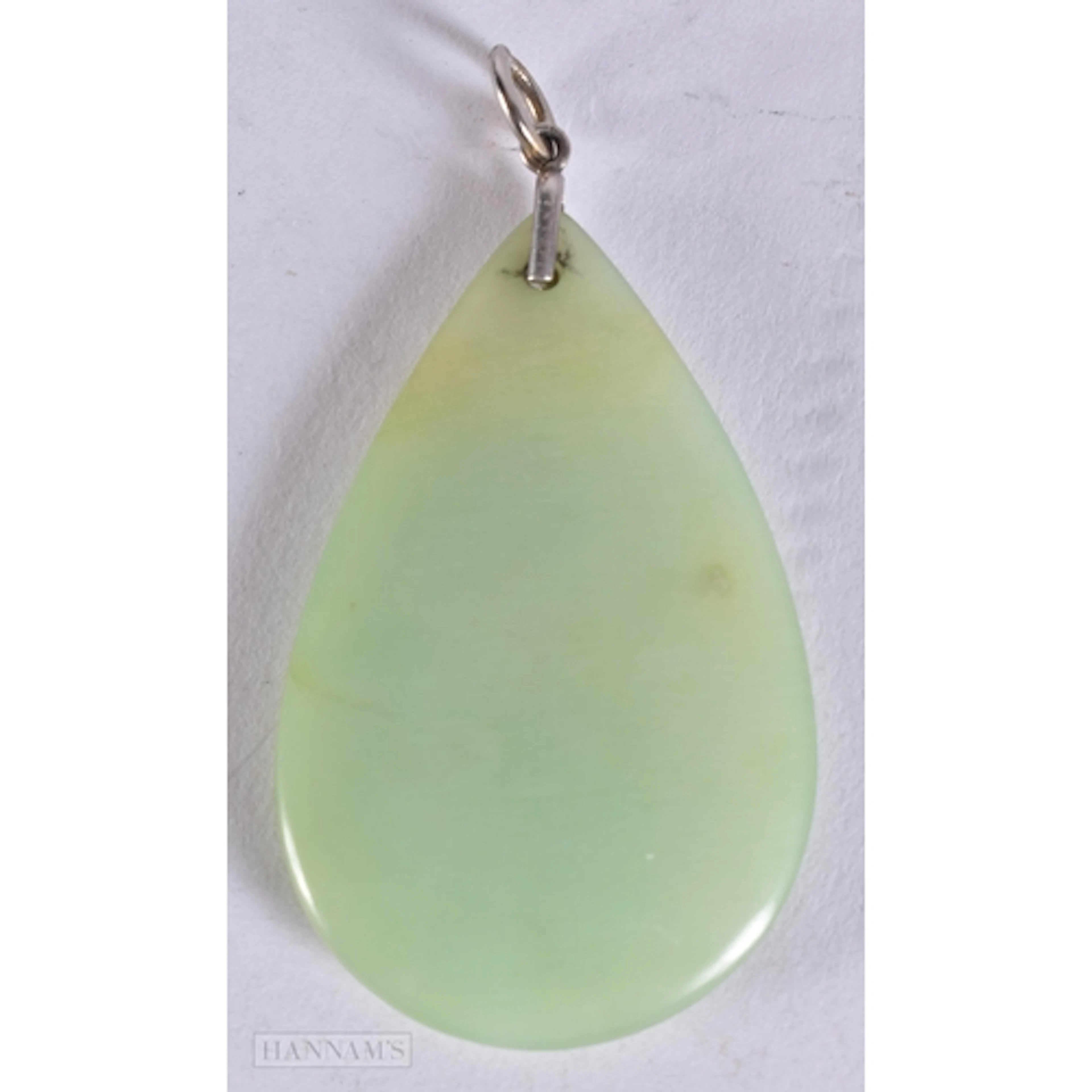 A JADE GLASS PENDANT. 6.75 cm x 3.5 cm.