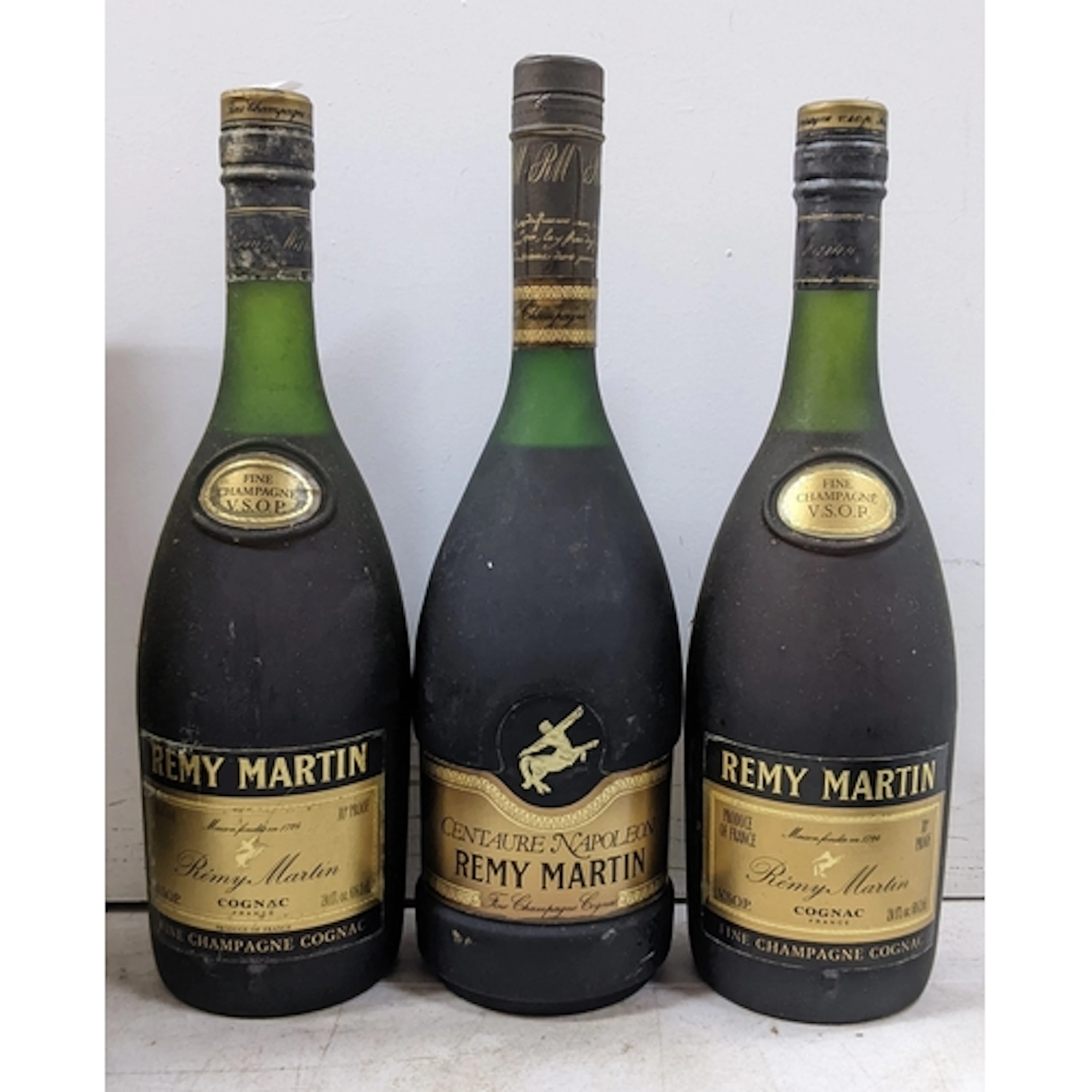 A group of three bottles of Rémy Martin Cognac, comprising: ...