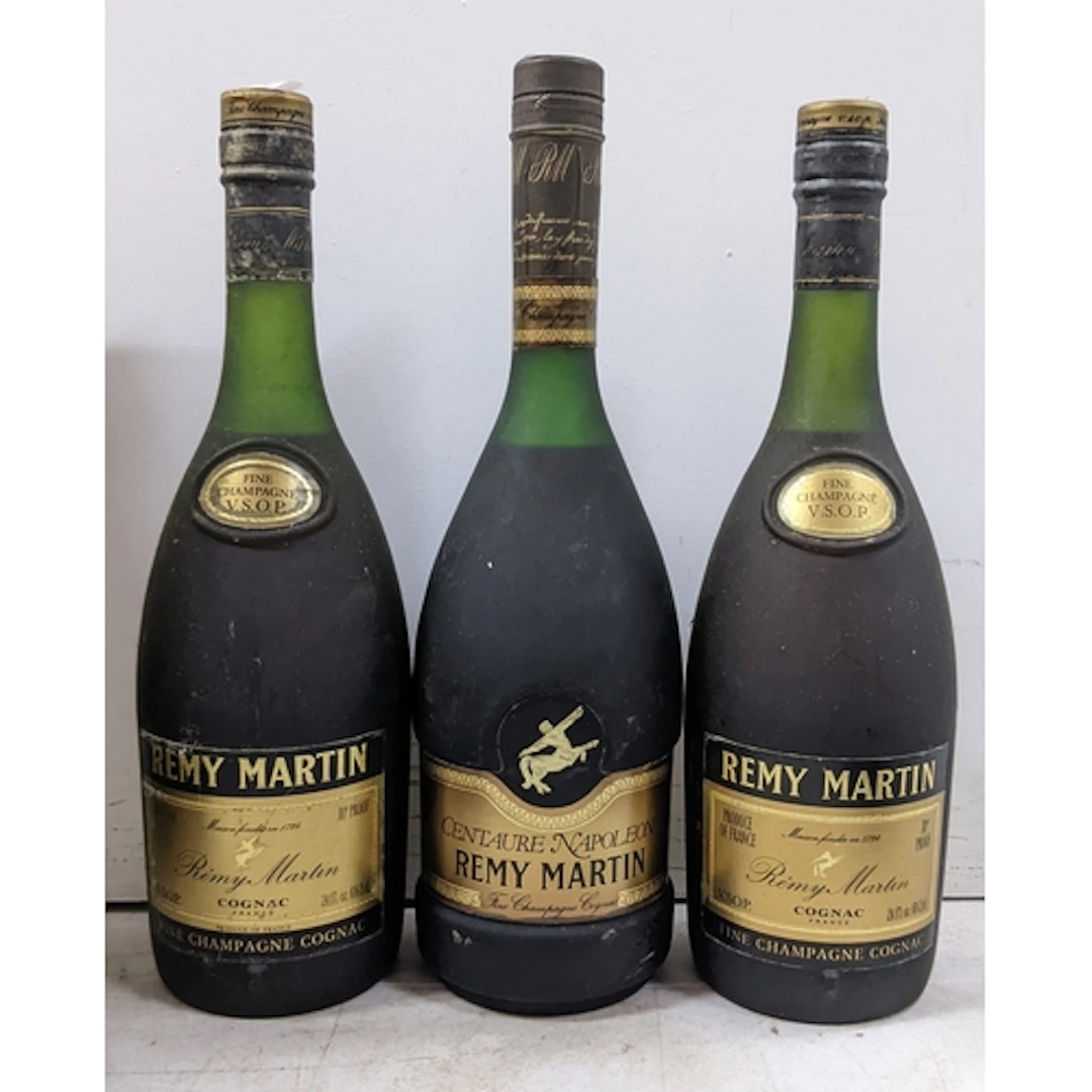 A group of three bottles of Rémy Martin Cognac, comprising: ...