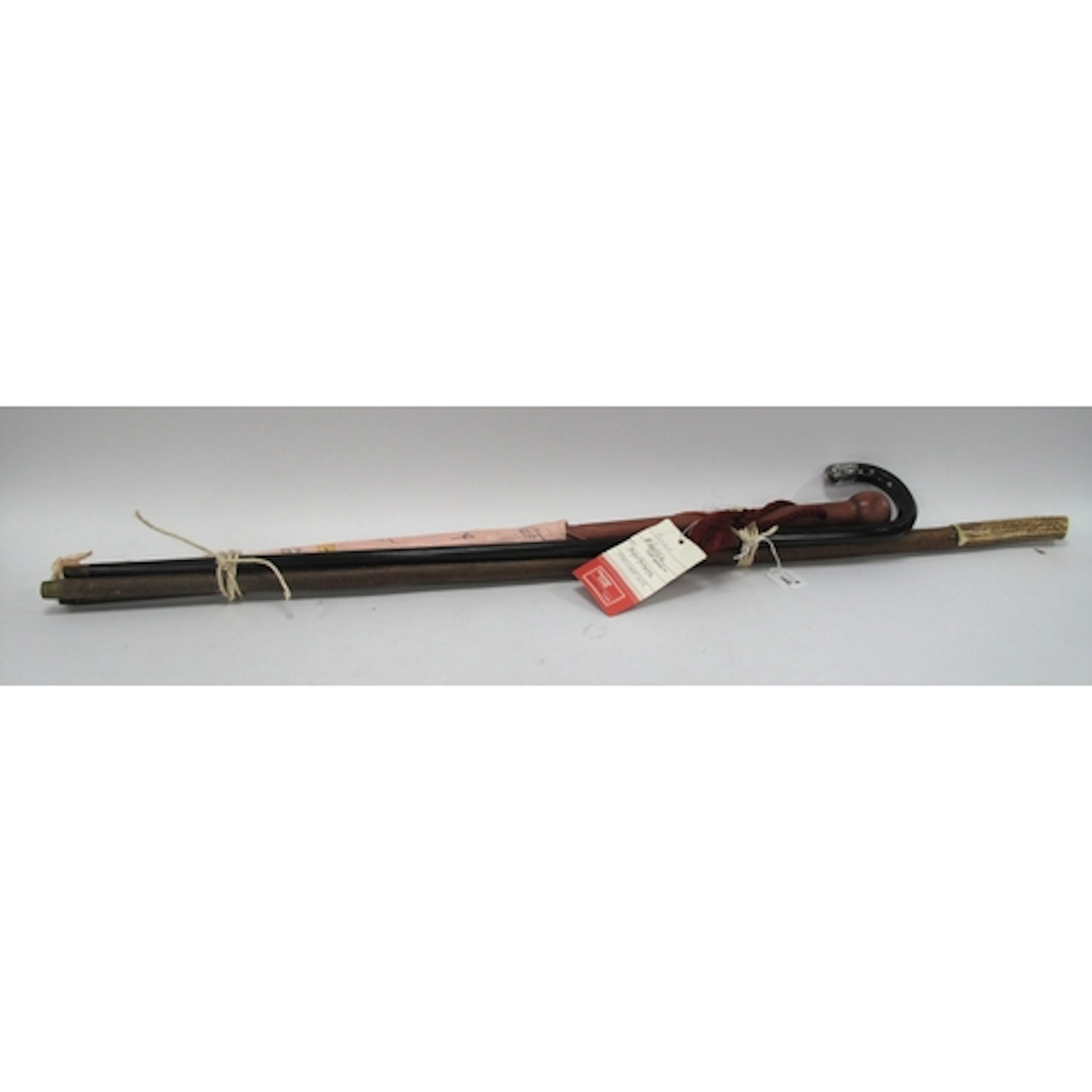 Four vintage walking sticks and canes, including ebonised cr...