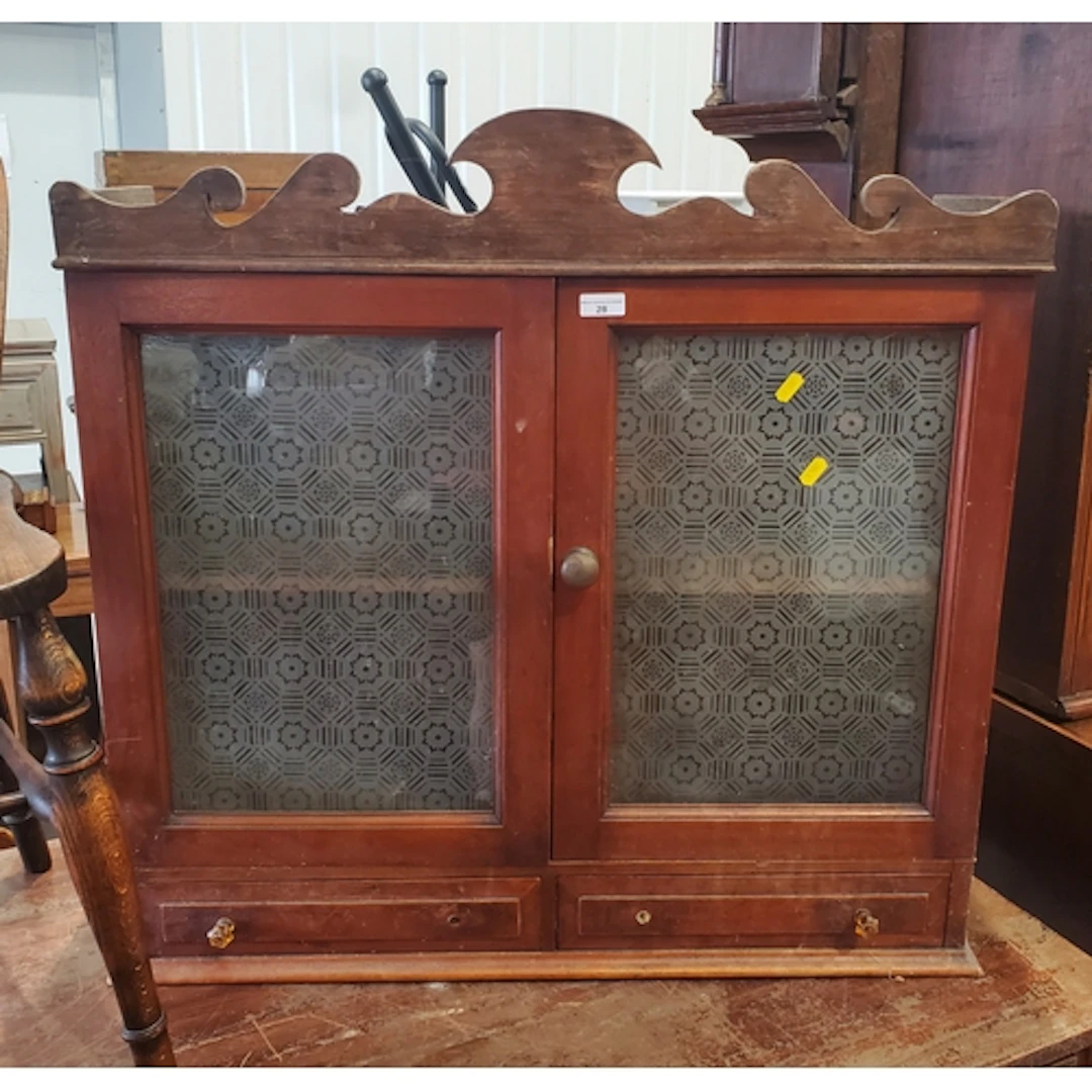 A hanging Wall Cupboard with shaped frieze/cornice with a pa...