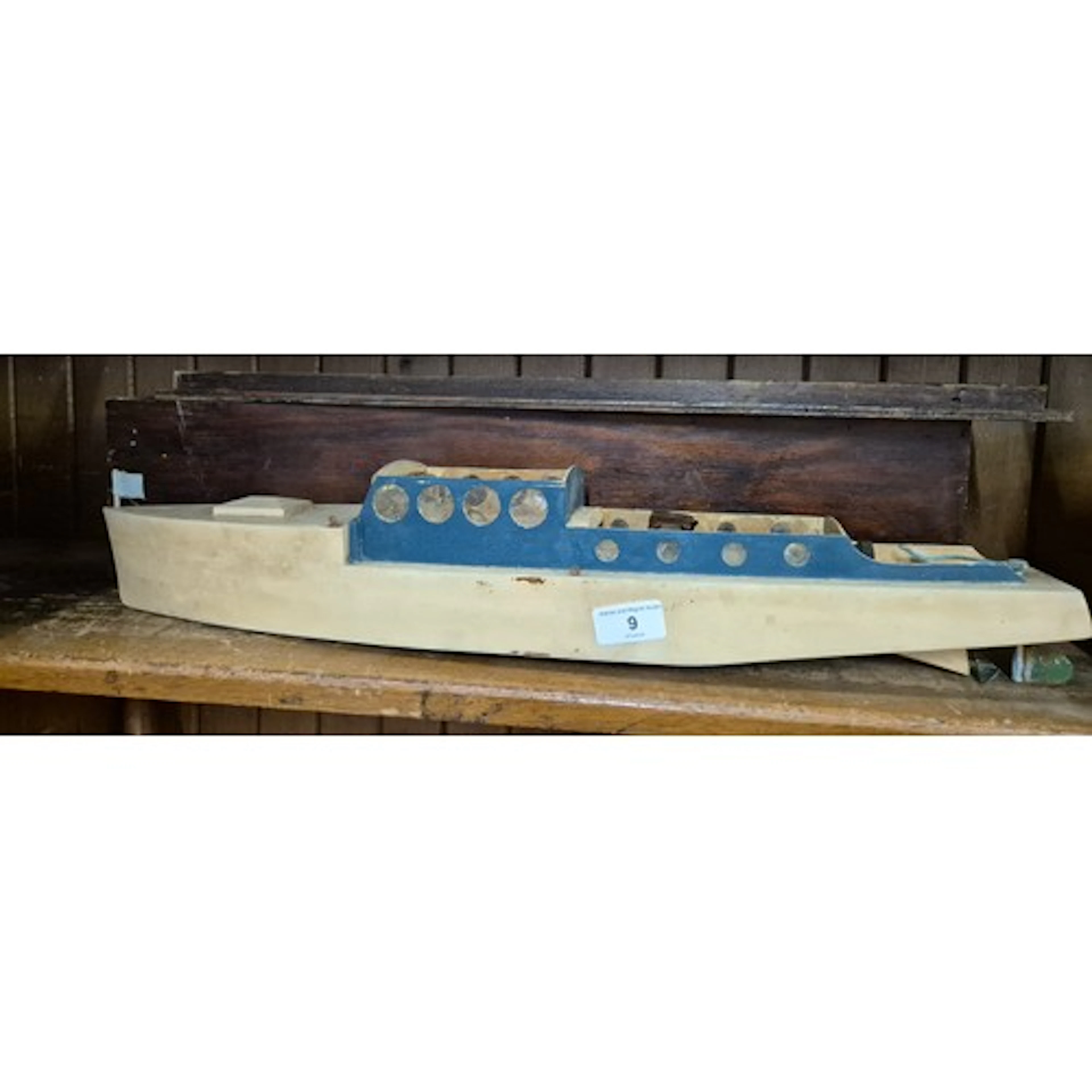 A vintage wooden boat with electric motor