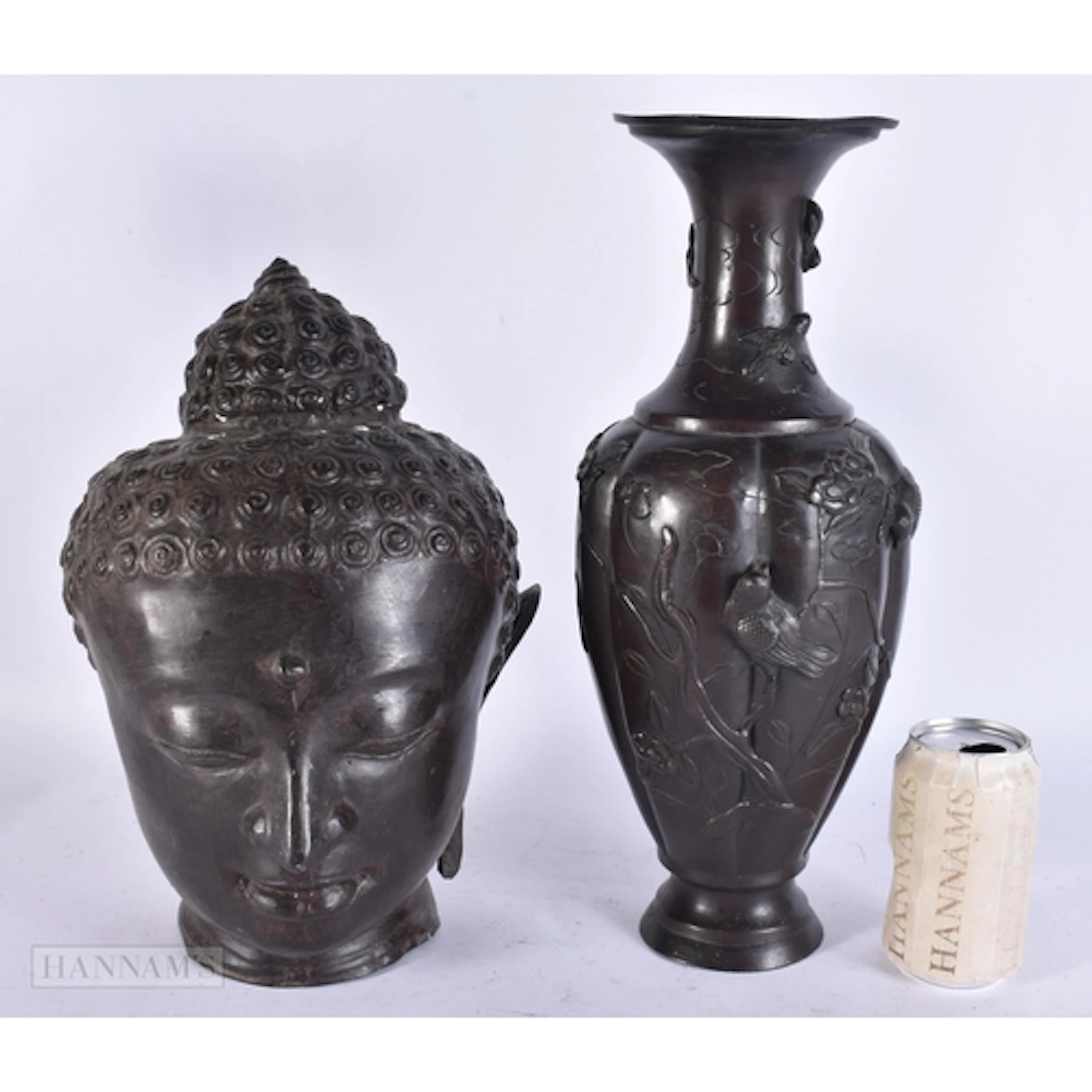AN ANTIQUE JAPANESE BRONZE VASE and a bronze buddha head. La...