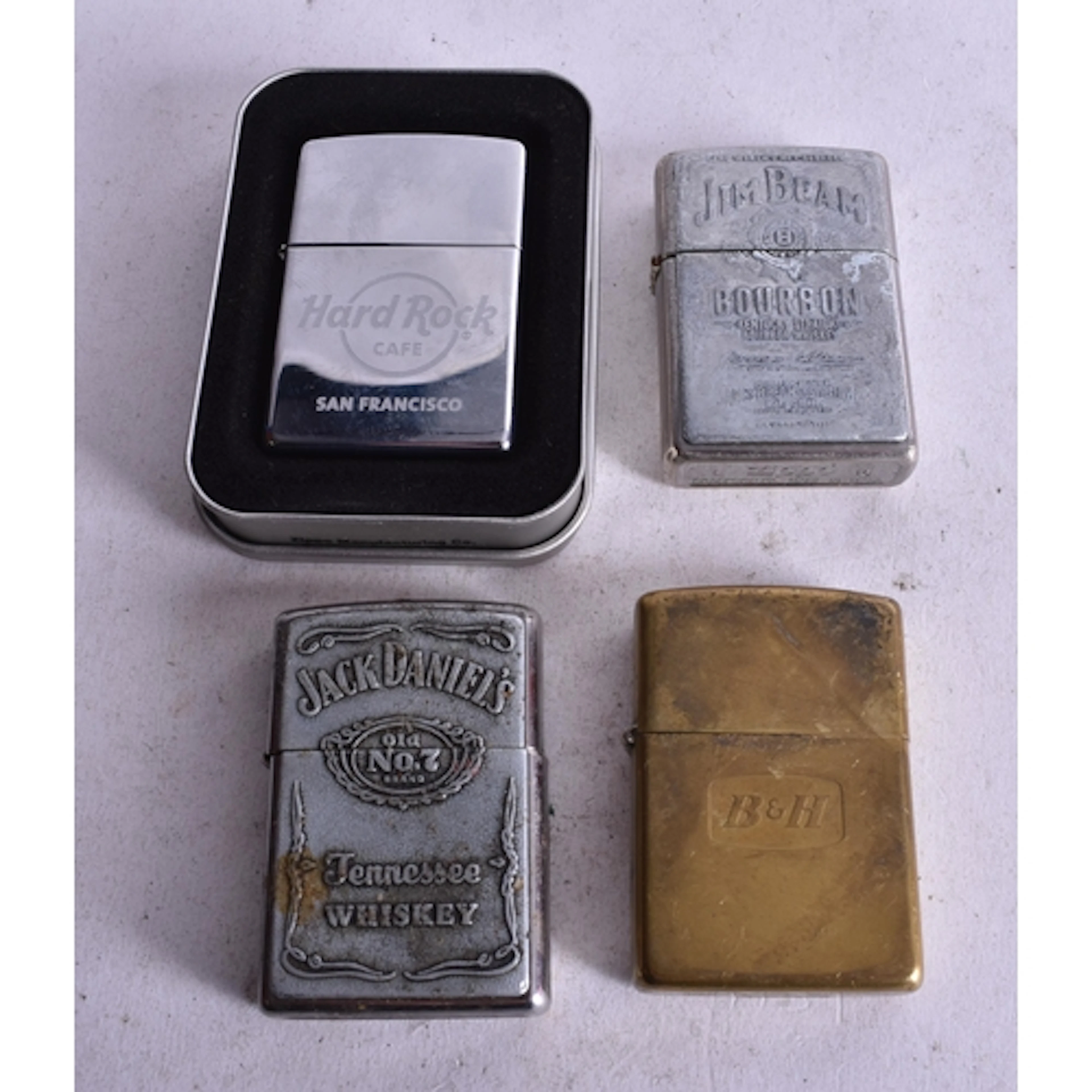 Four Zippo Lighters incl Hard Rock Cafe, Jack Daniels, Jim B...