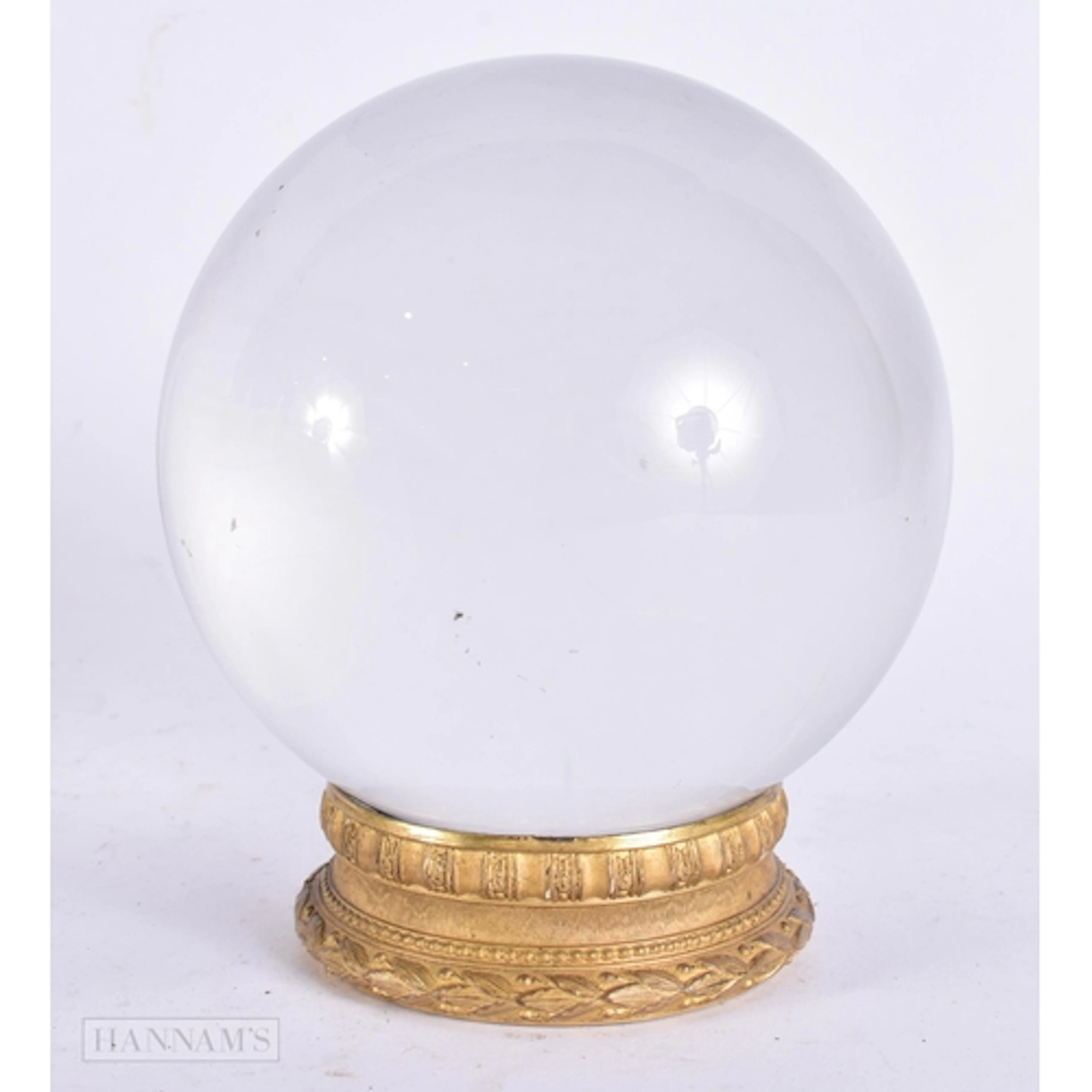 AN ANTIQUE FRENCH CRYSTAL BALL ON STAND. 11.5 cm wide.