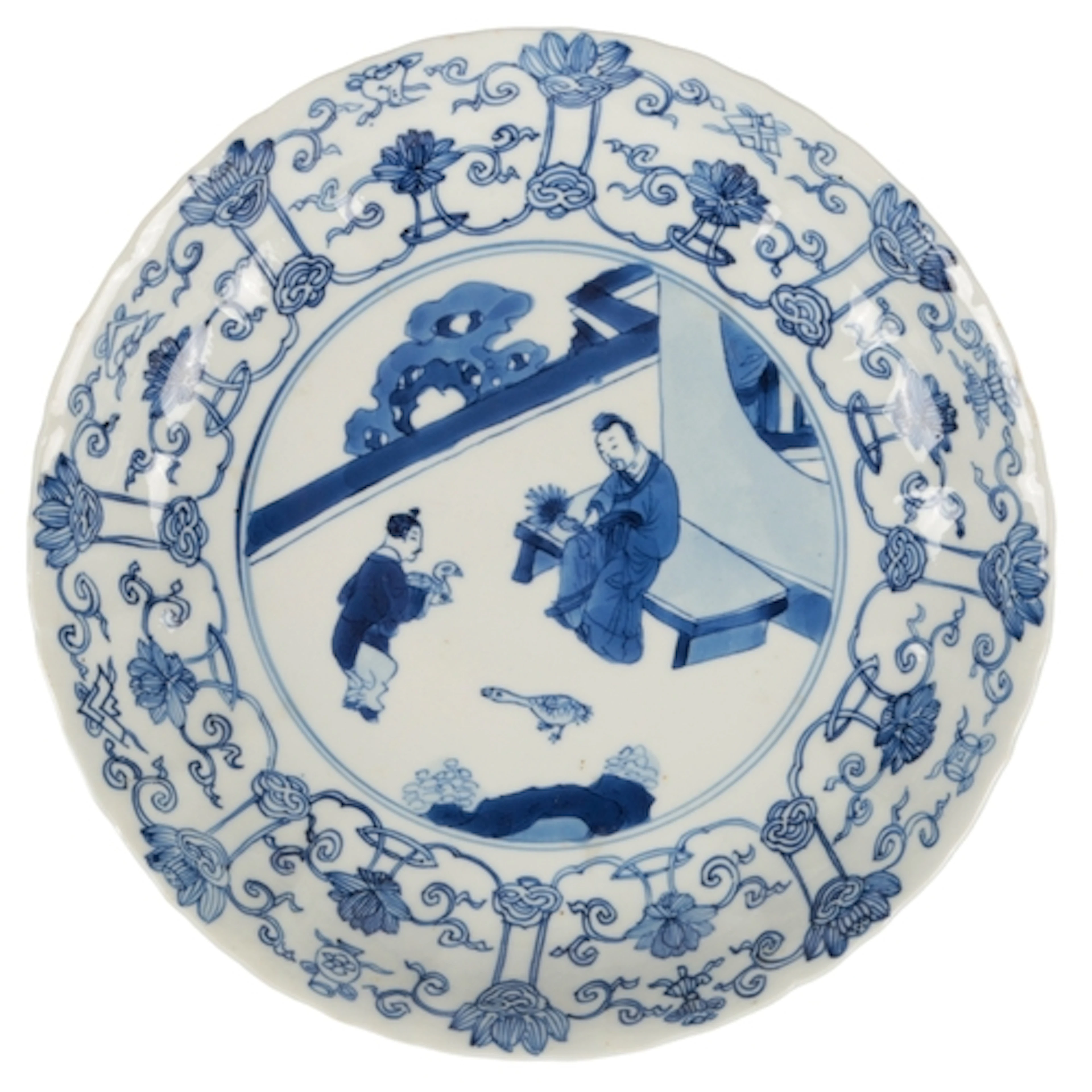 A Chinese blue and white 'scholar and boy' dish, Kangxi mark...