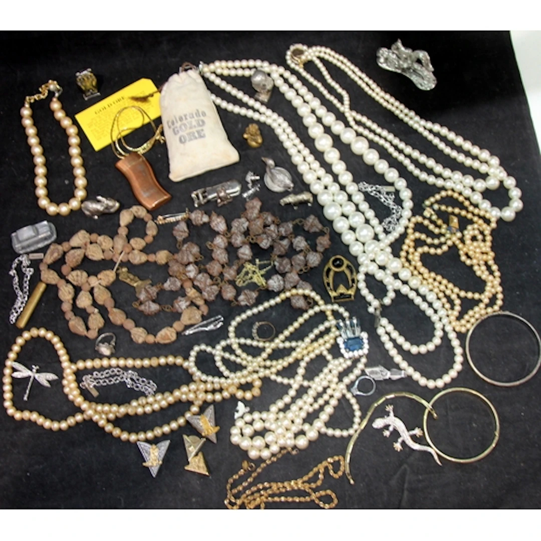 A collection of costume jewellery and curios