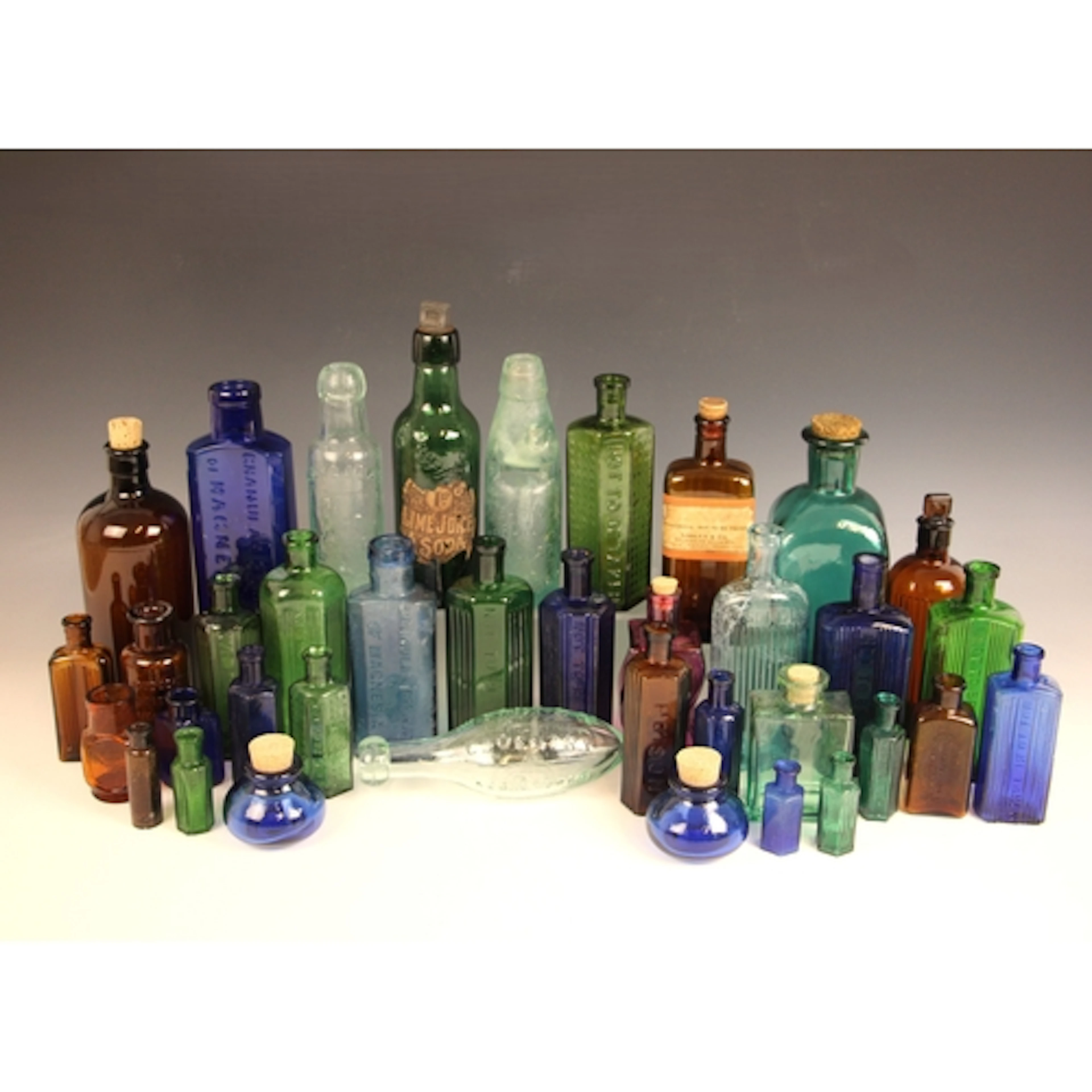 A quantity of blue, green and brown glass poison bottles, la...
