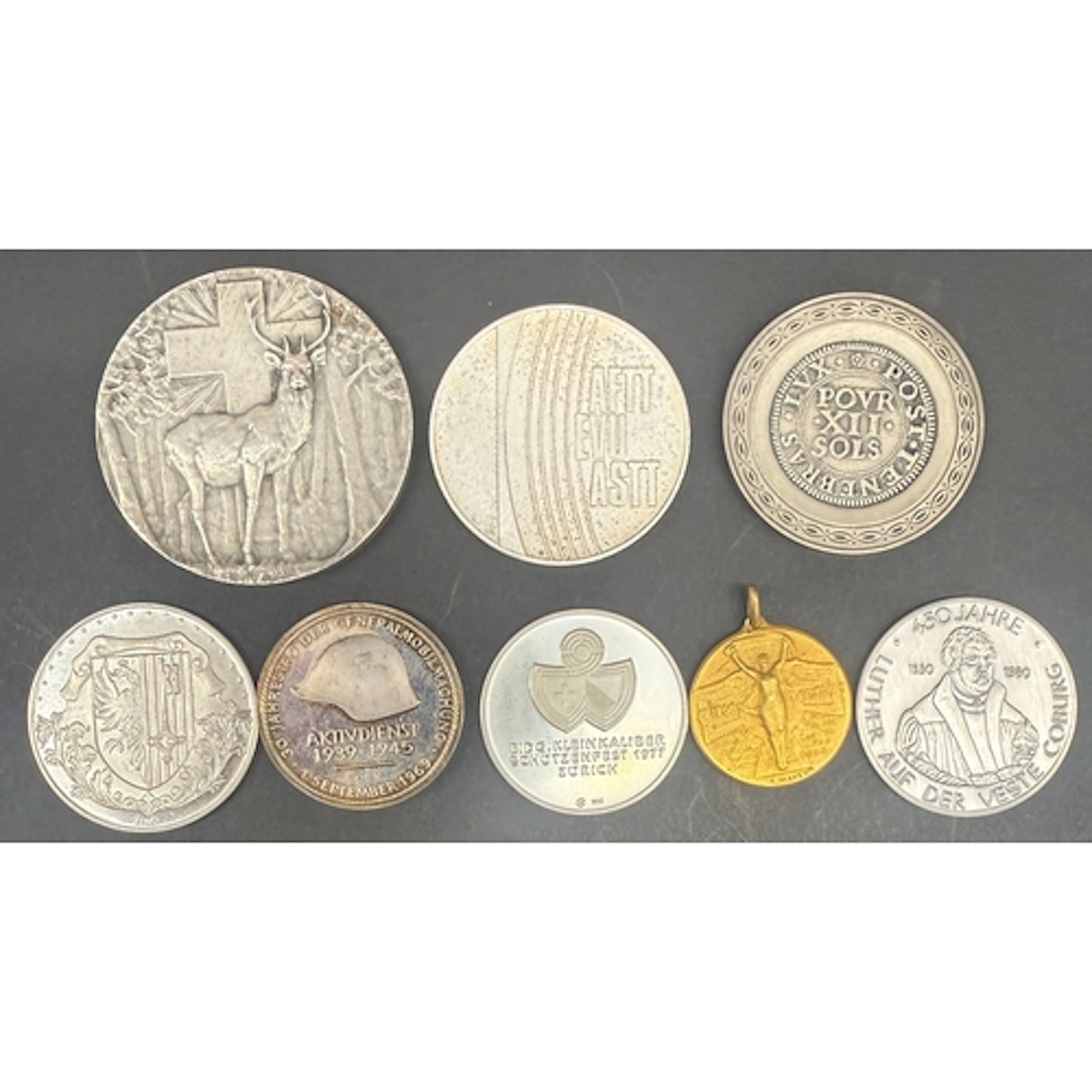 A group of eight European commemorative and award medals, in...