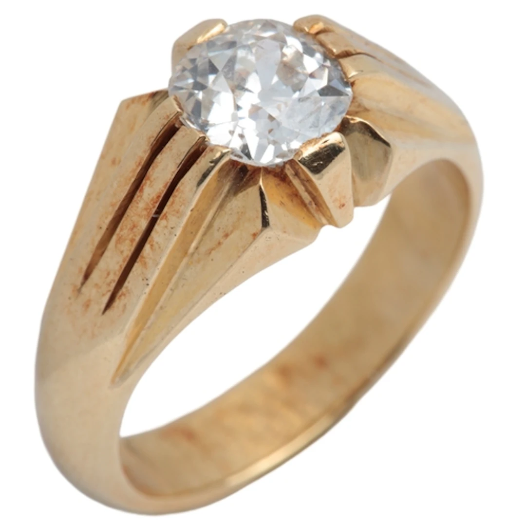 A gold and diamond ring, mid 20th century, set with a cushio...