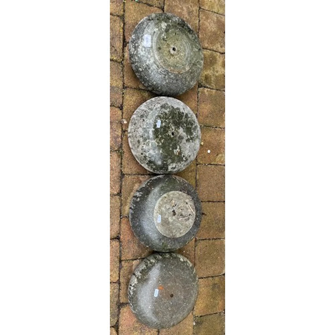 Four assorted curling stones(one damaged)