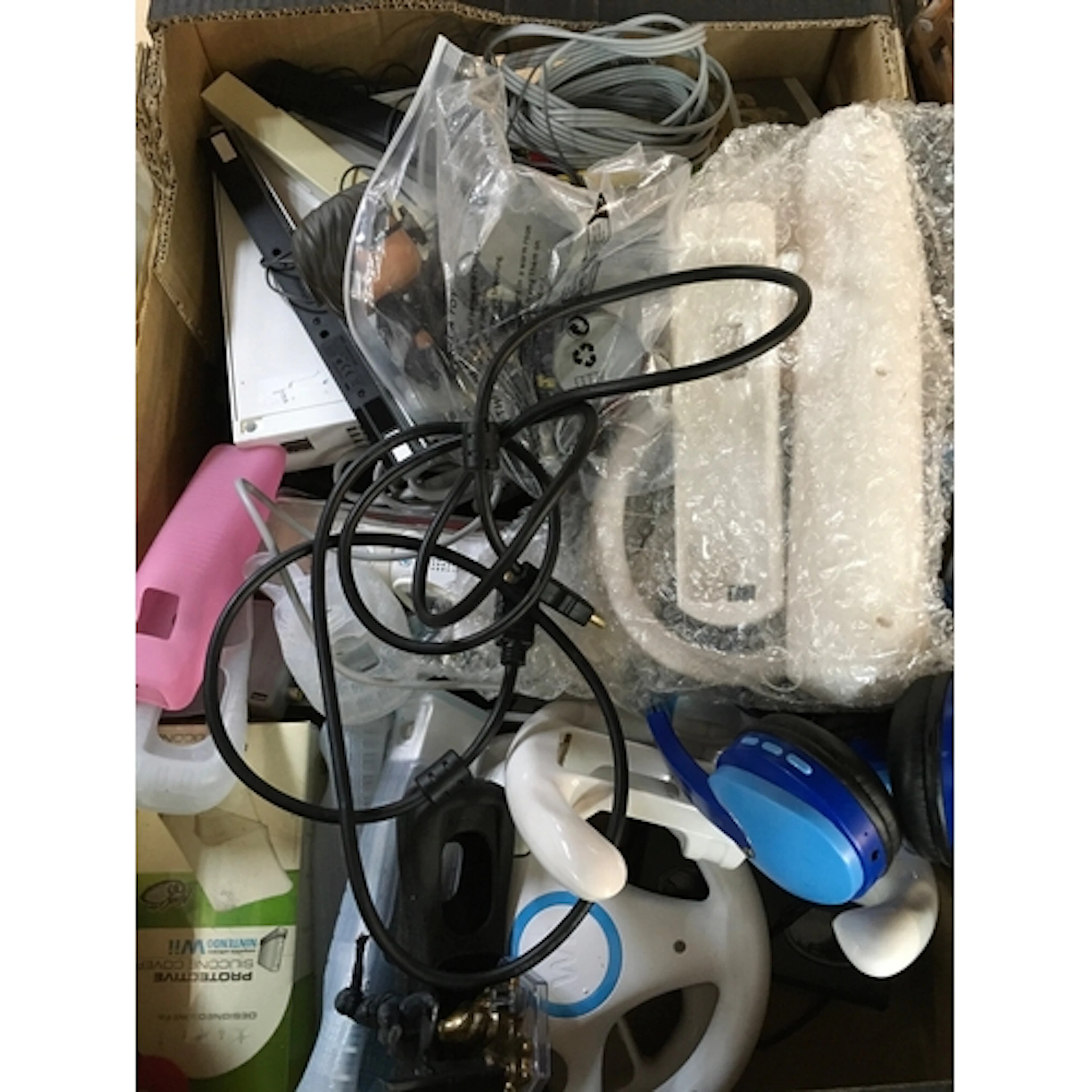 Two Nintendo Wii consoles, three controllers and games inclu...