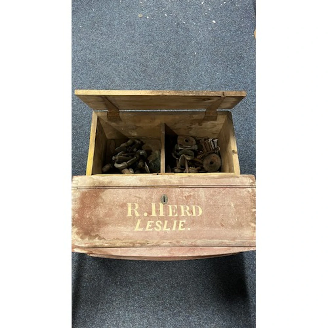 Two vintage boxes containing curling stone handles, etc.