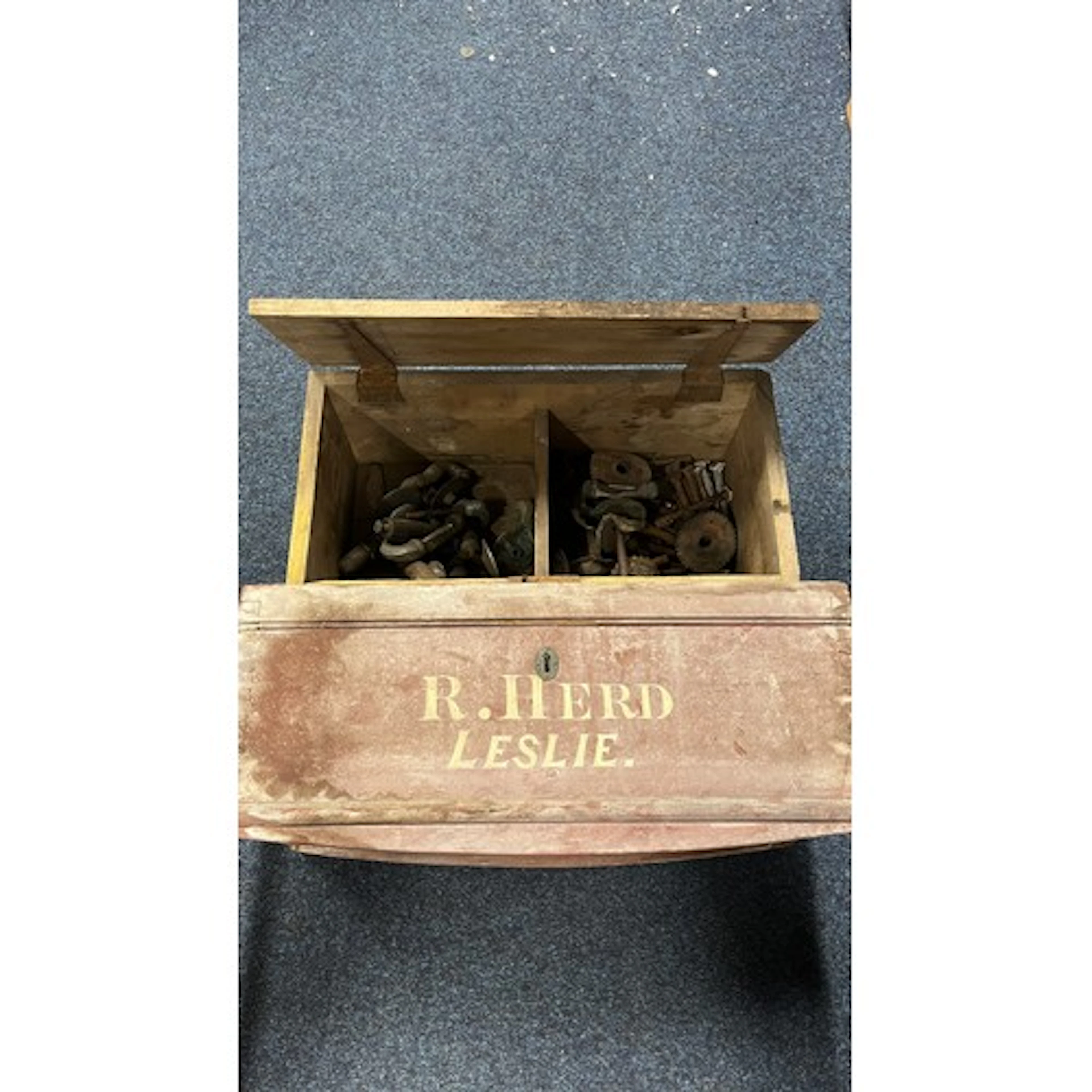 Two vintage boxes containing curling stone handles, etc.