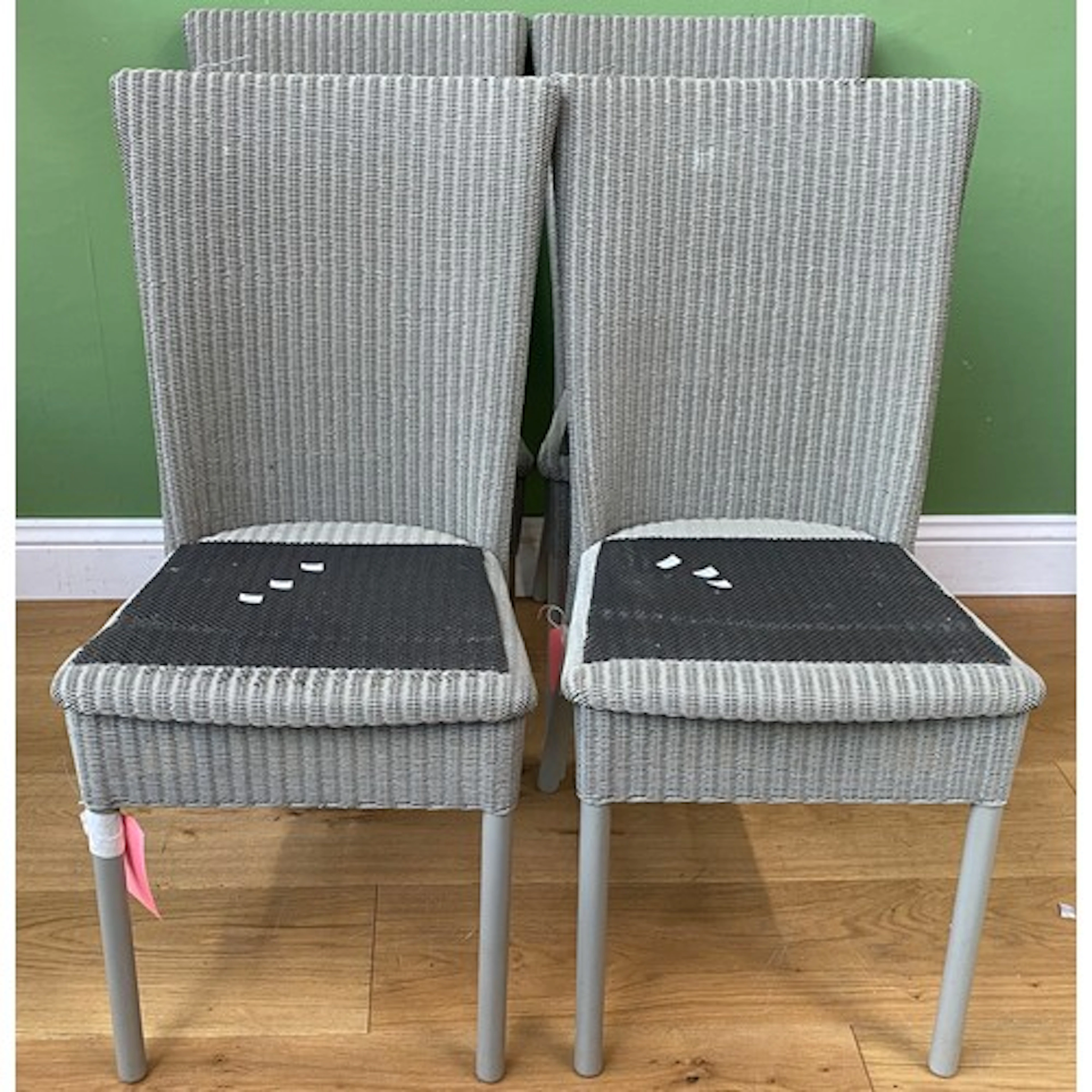 A set of six modern grey painted Lloyd Loom chairs, bearing ...