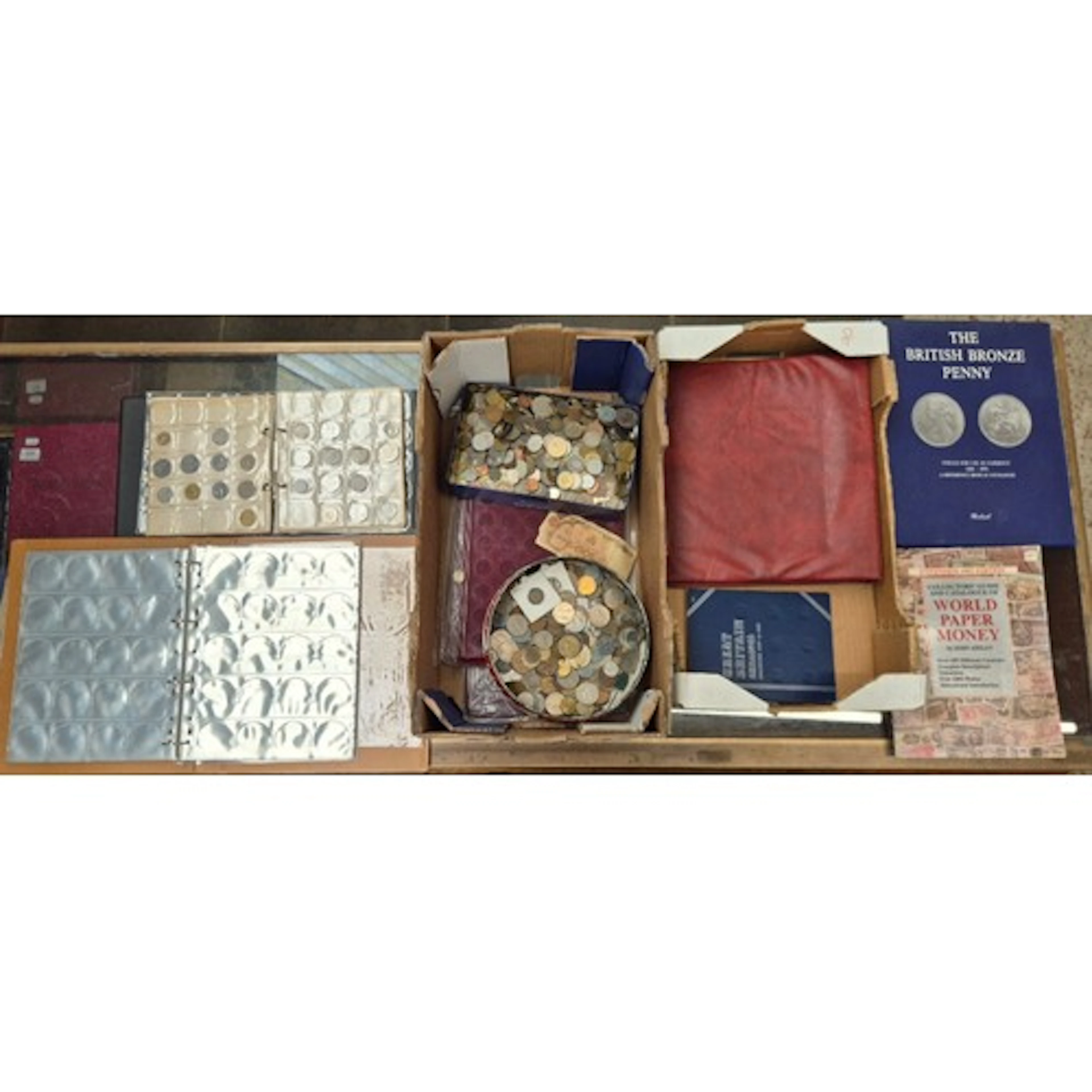 A box of assorted world coins & a box of coin accessories.