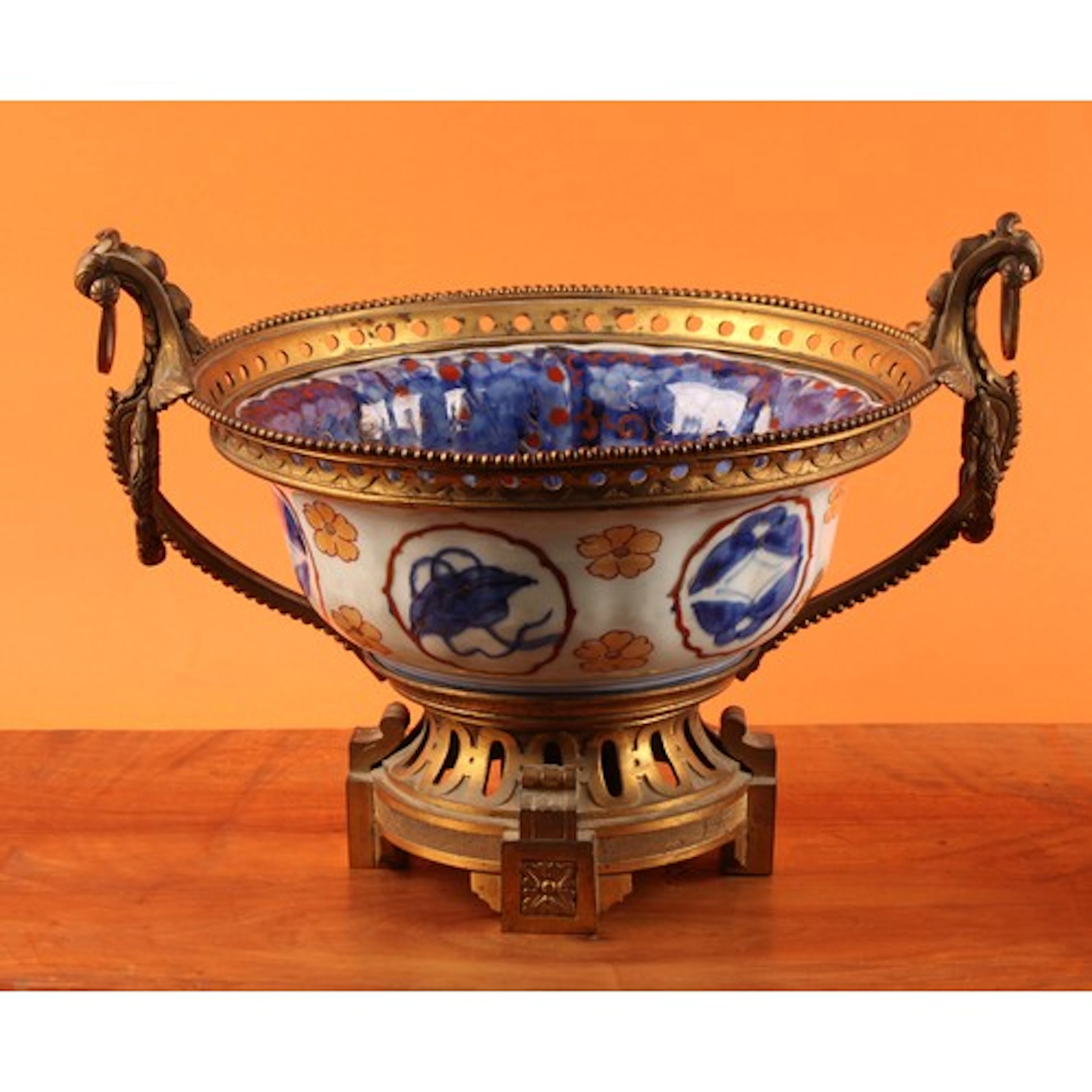 A 19th century French faience and ormolu mounted table centr...