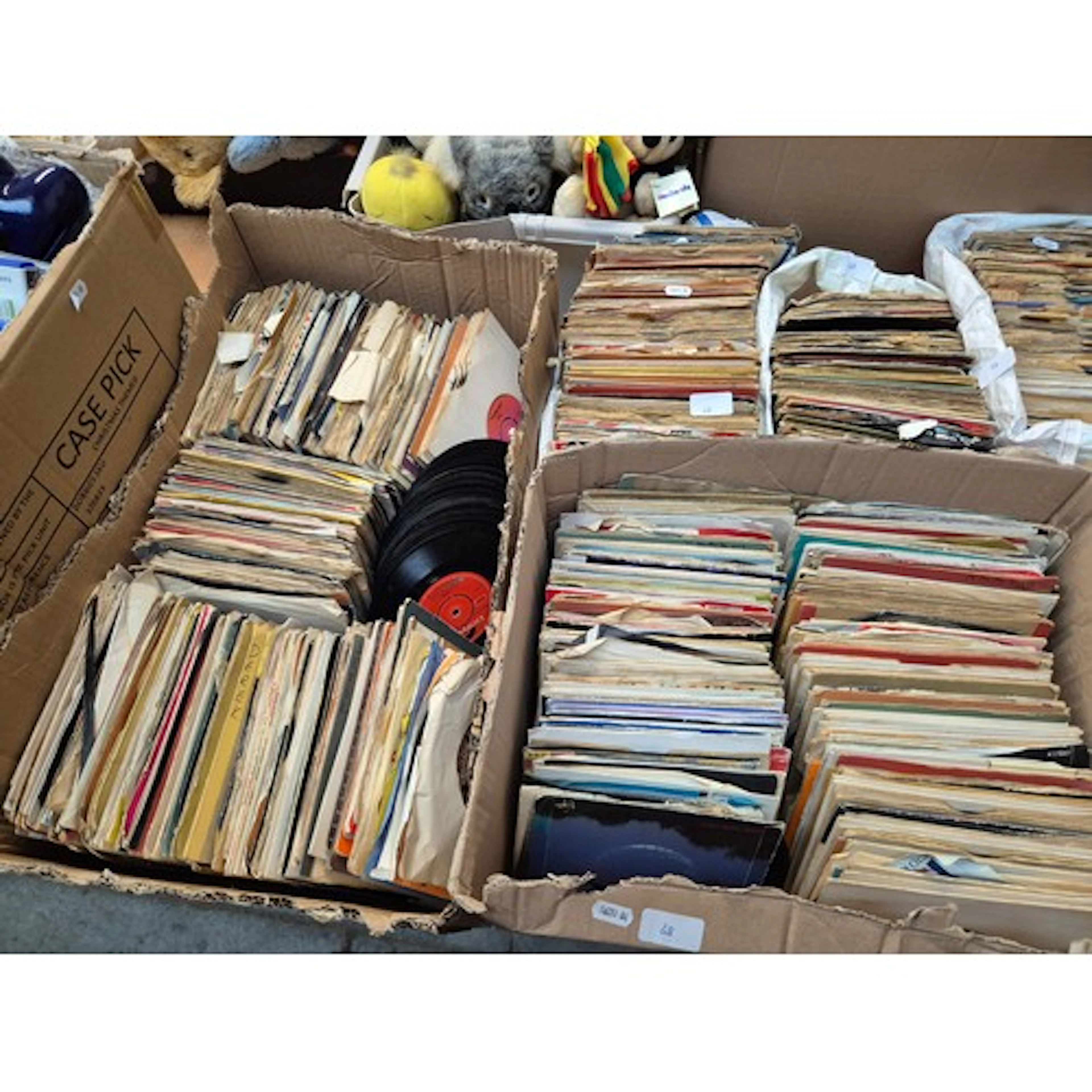 Two boxes and three bags of assorted 45s.