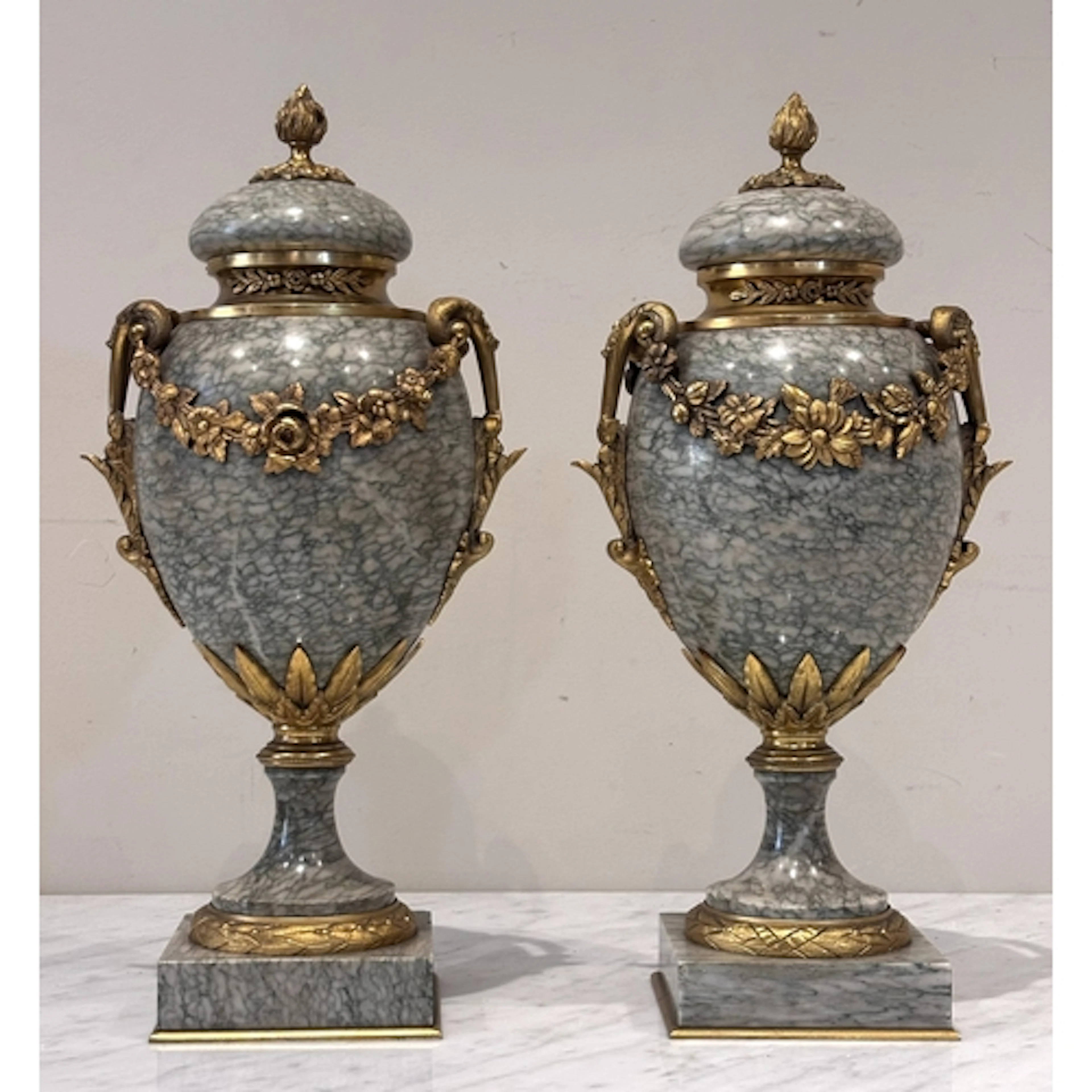 A pair of French Louis XVI style green marble and ormolu mou...