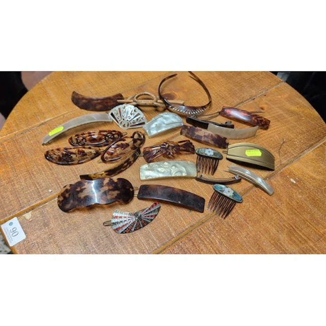 A collection of hair ornaments, including tortoiseshell-effe...