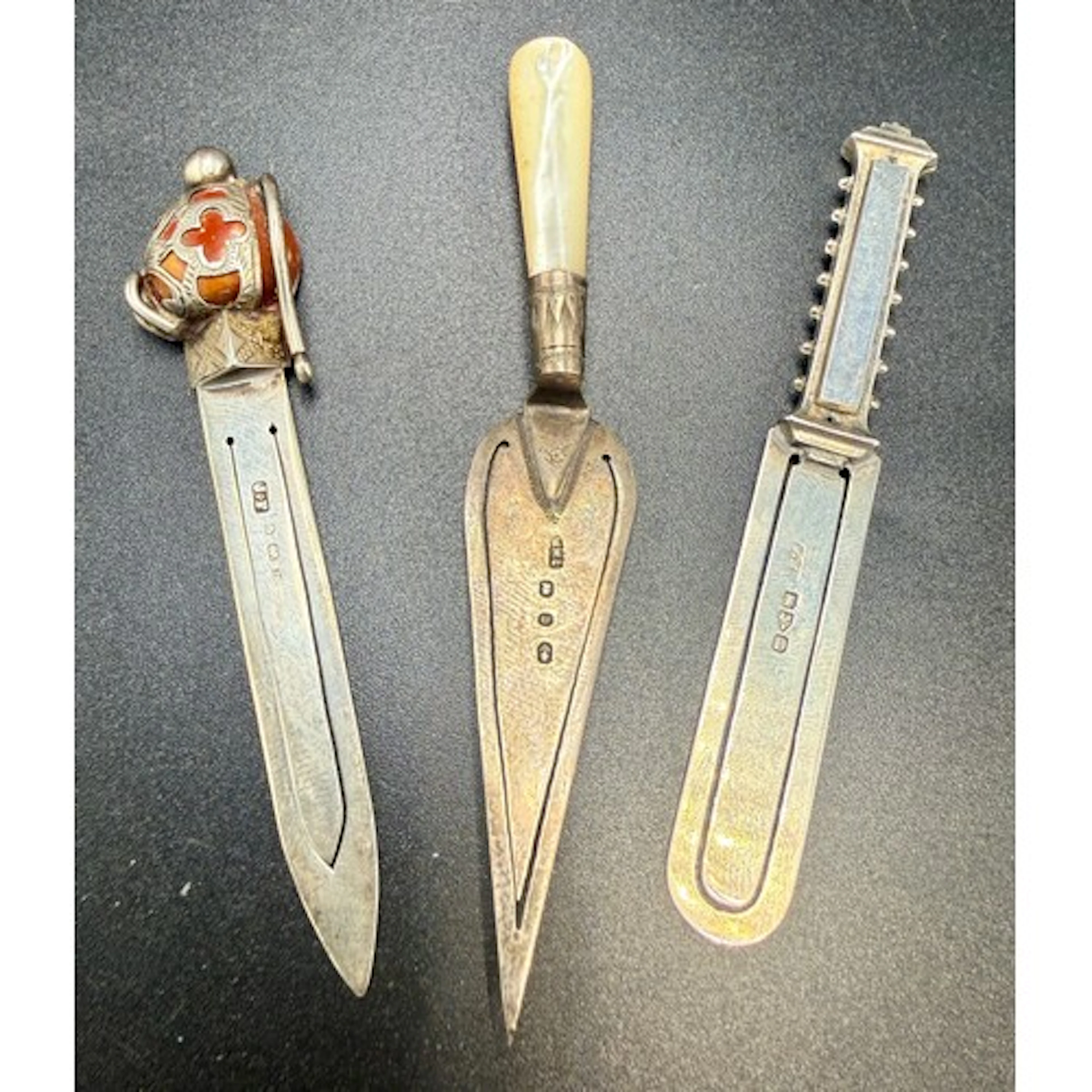 Three hallmarked silver book trowels various dates and maker...