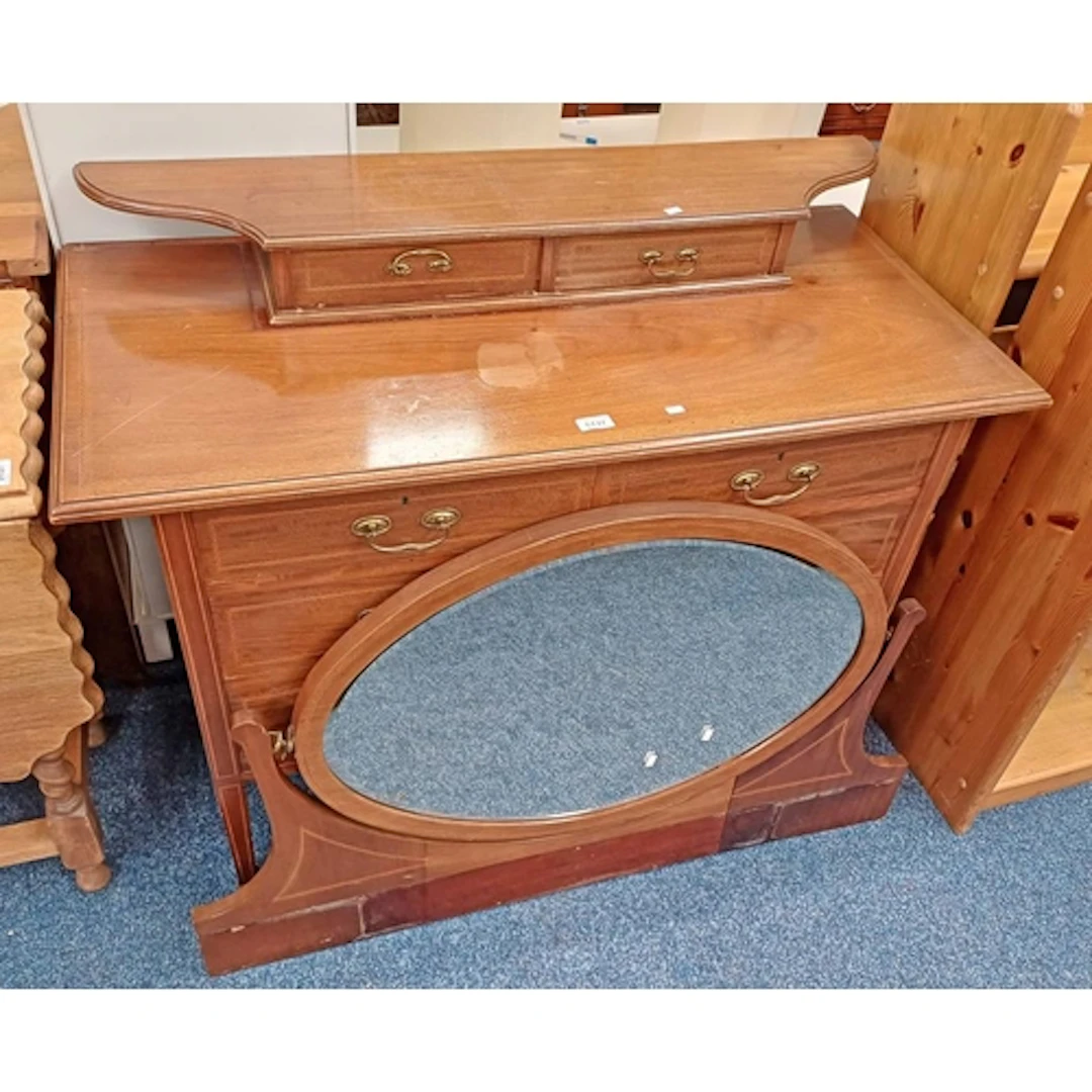 EARLY 20TH CENTURY INLAID MAHOGANY DRESSING CHEST. THE OVAL ...