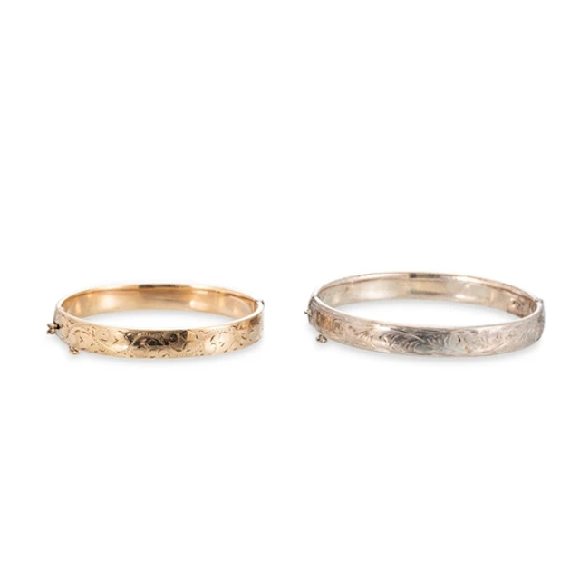 A STERLING SILVER ENGRAVED BANGLE, Birmingham hallmark, toge...