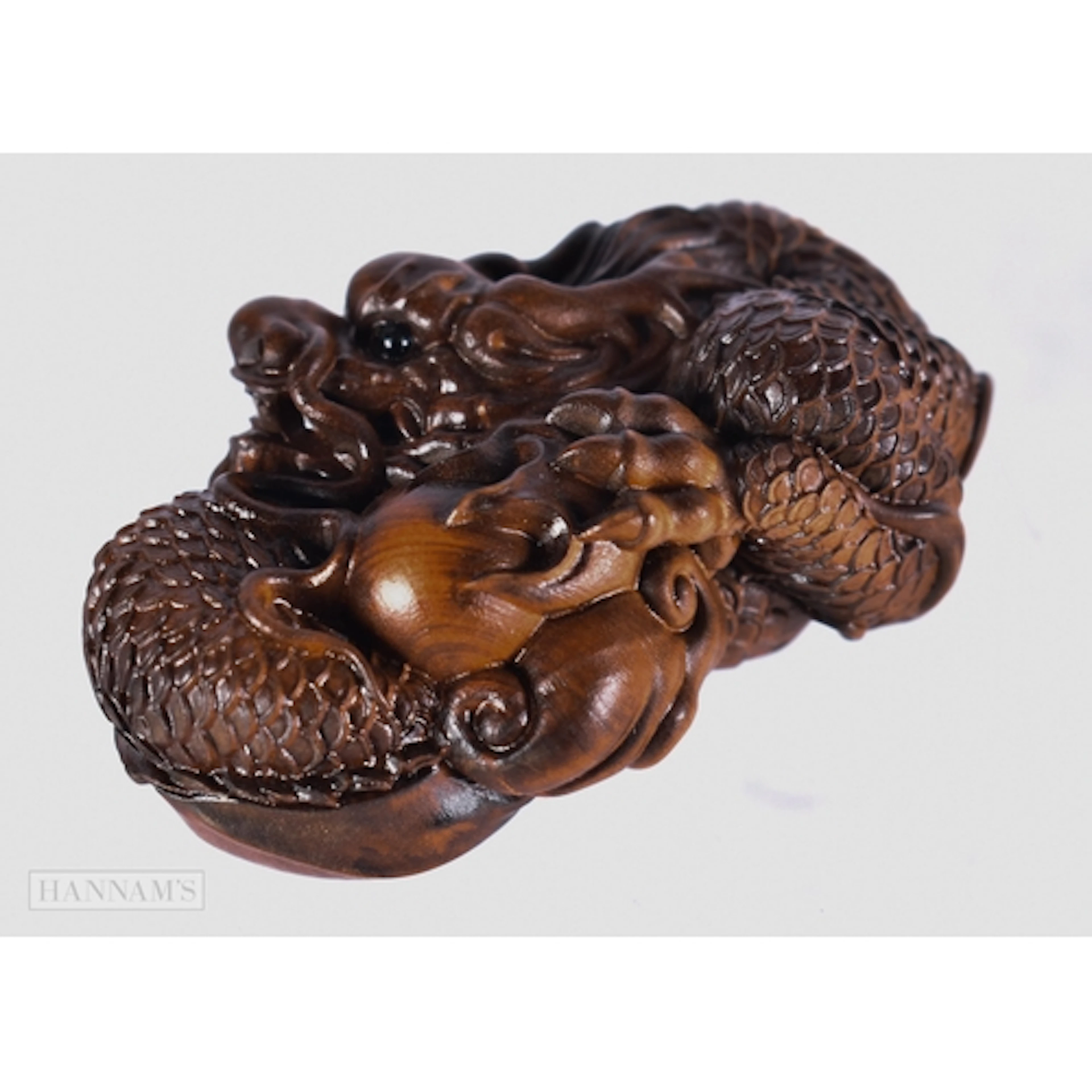 A CARVED WOOD DRAGON. 3.5 x 7.7 x 4.5 cm