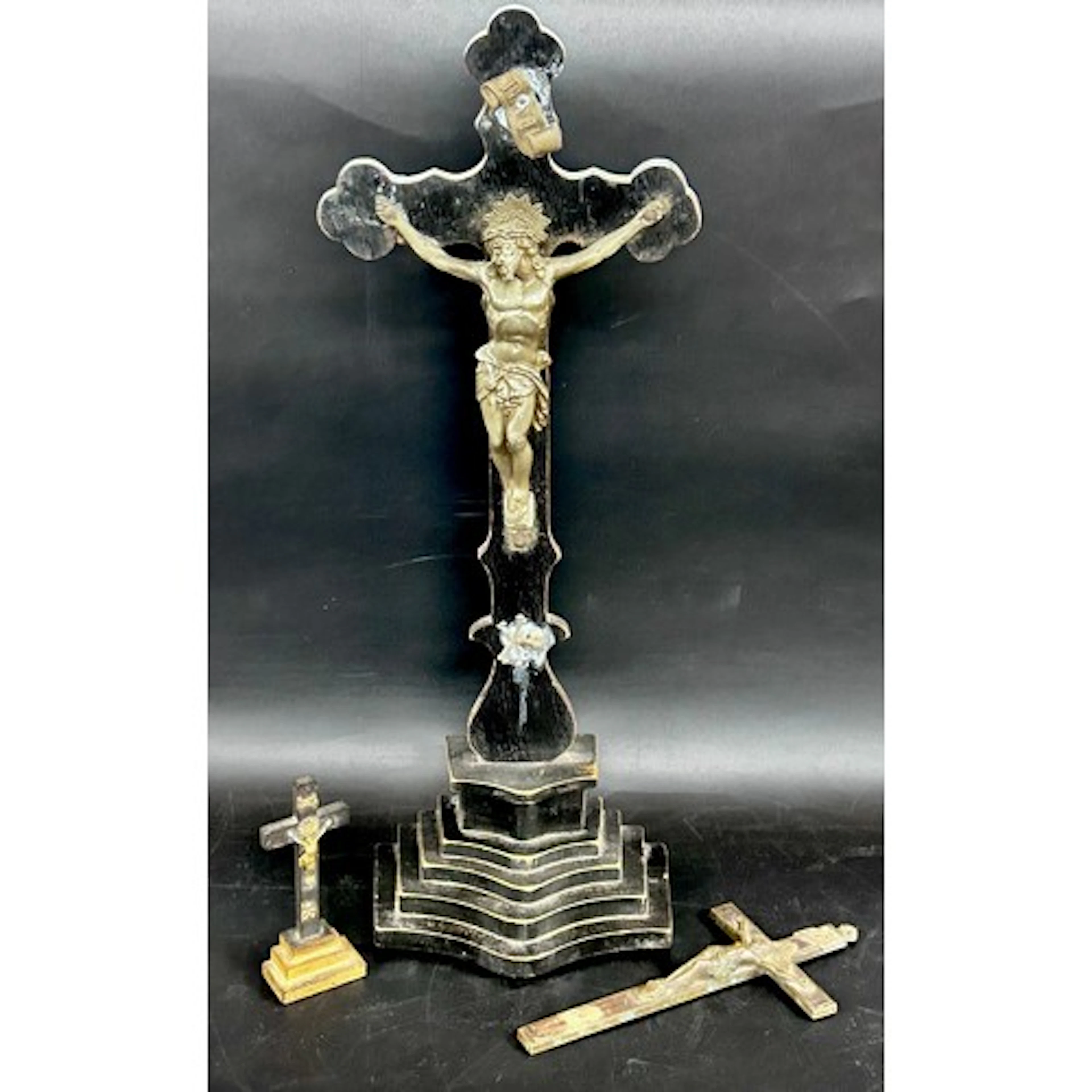 Two wooden standing Crucifixes, and a brass crucifix, larges...