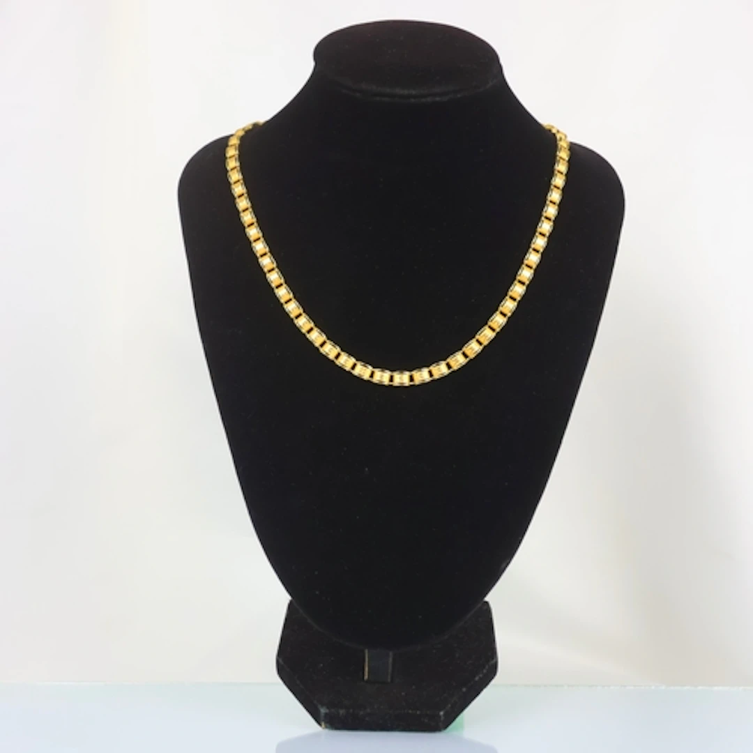 A contemporary Italian 9ct gold necklace, the openwork desig...