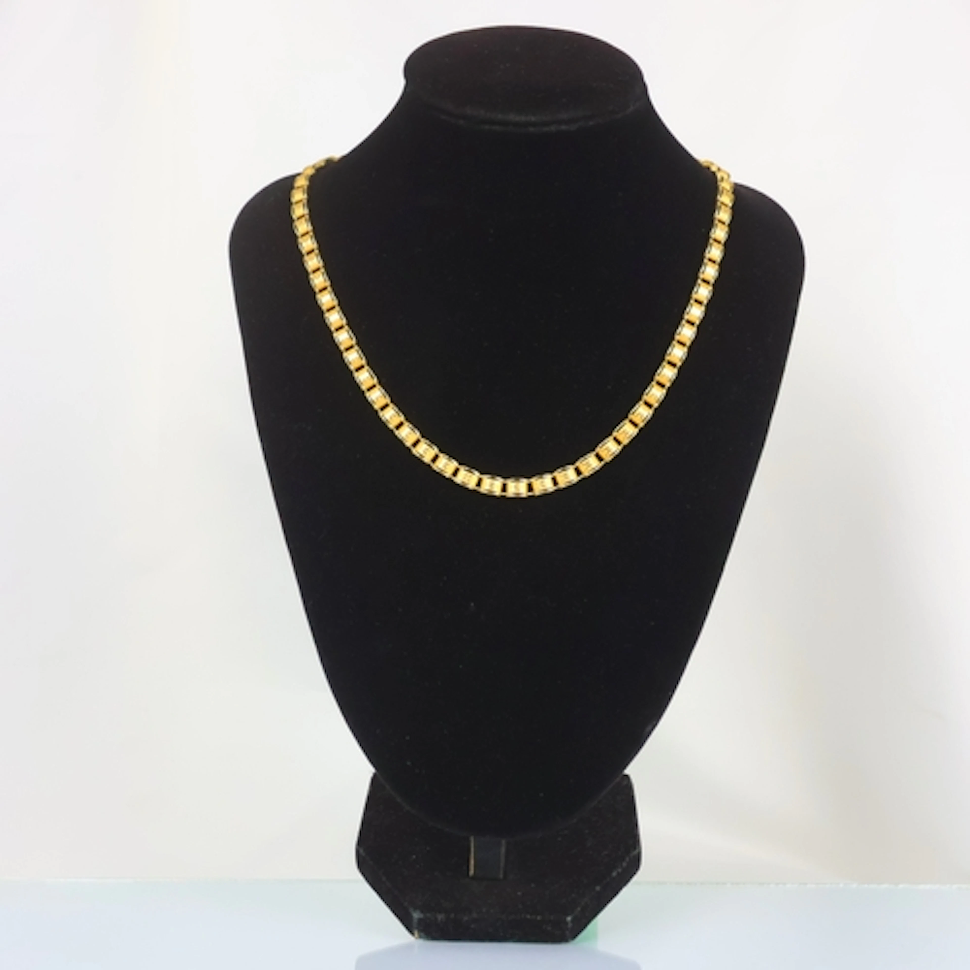 A contemporary Italian 9ct gold necklace, the openwork desig...