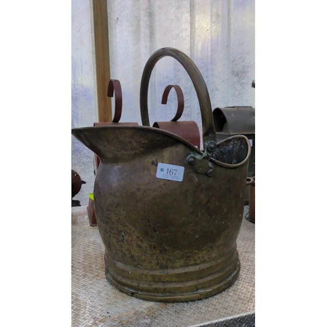 Brass helmet-form coal scuttle with a flared pouring lip
