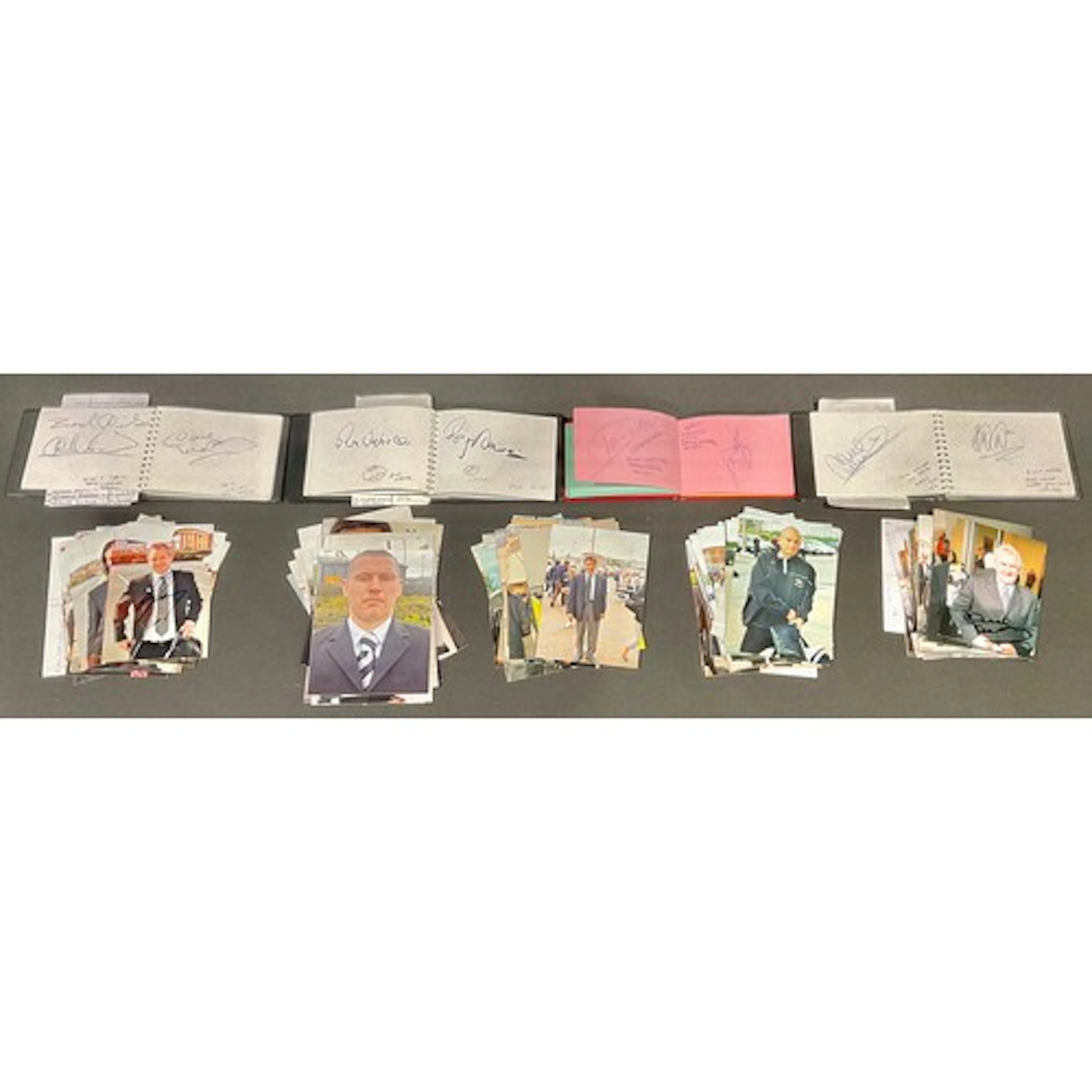 A fan collection of four autograph booklets bearing the sign...