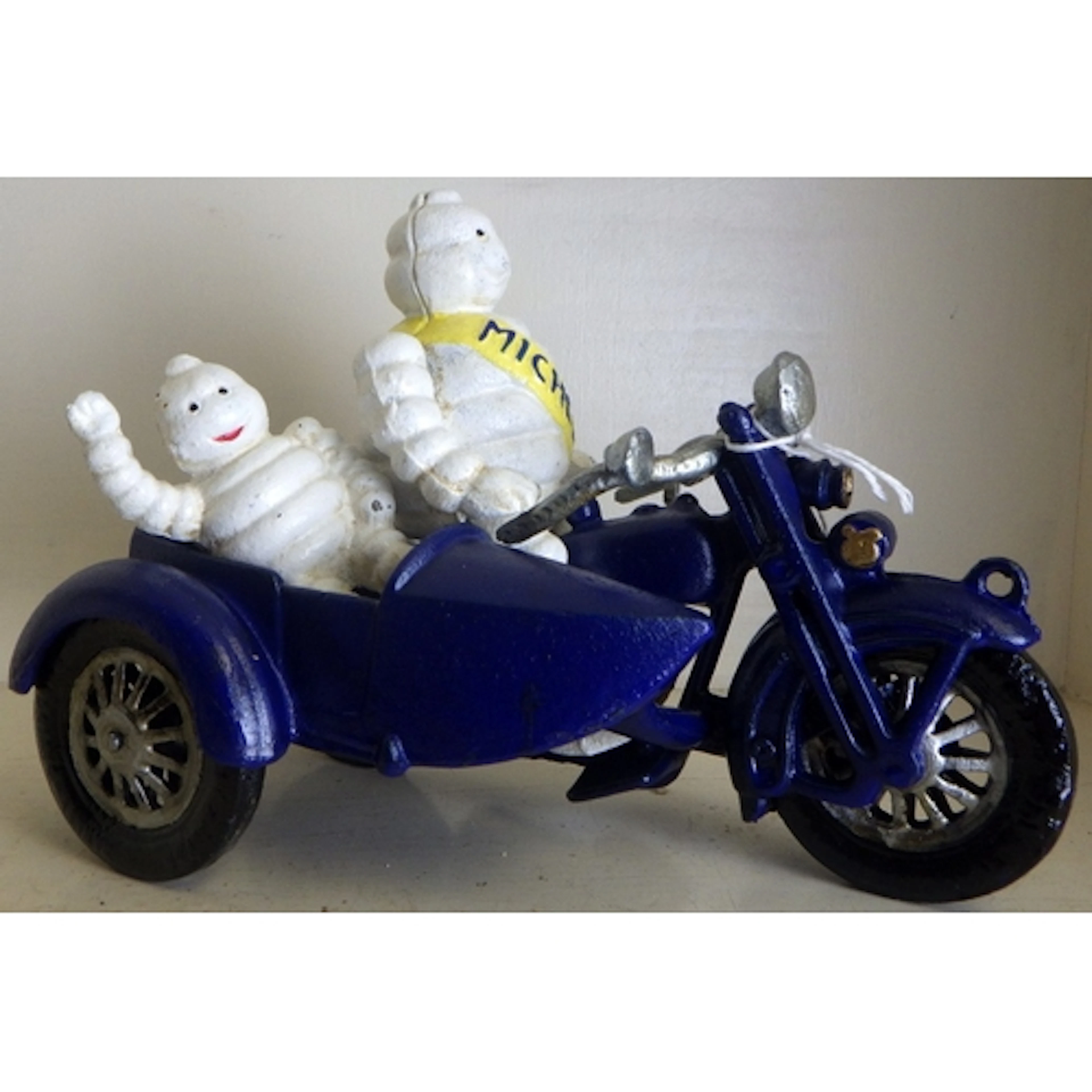 A cast Michelin sidecar figure