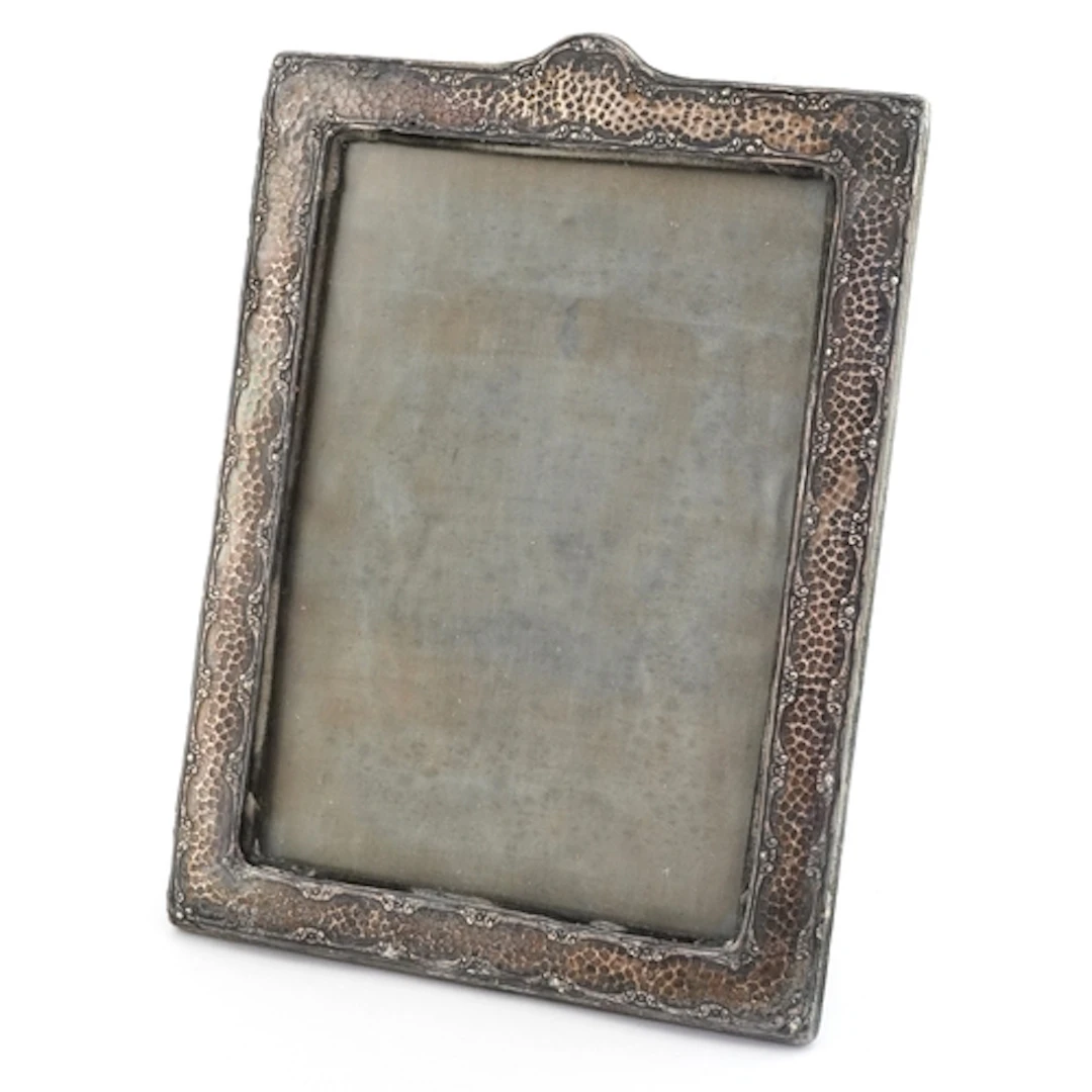 A Bromet & Co., Edwardian silver easel photo frame having pl...