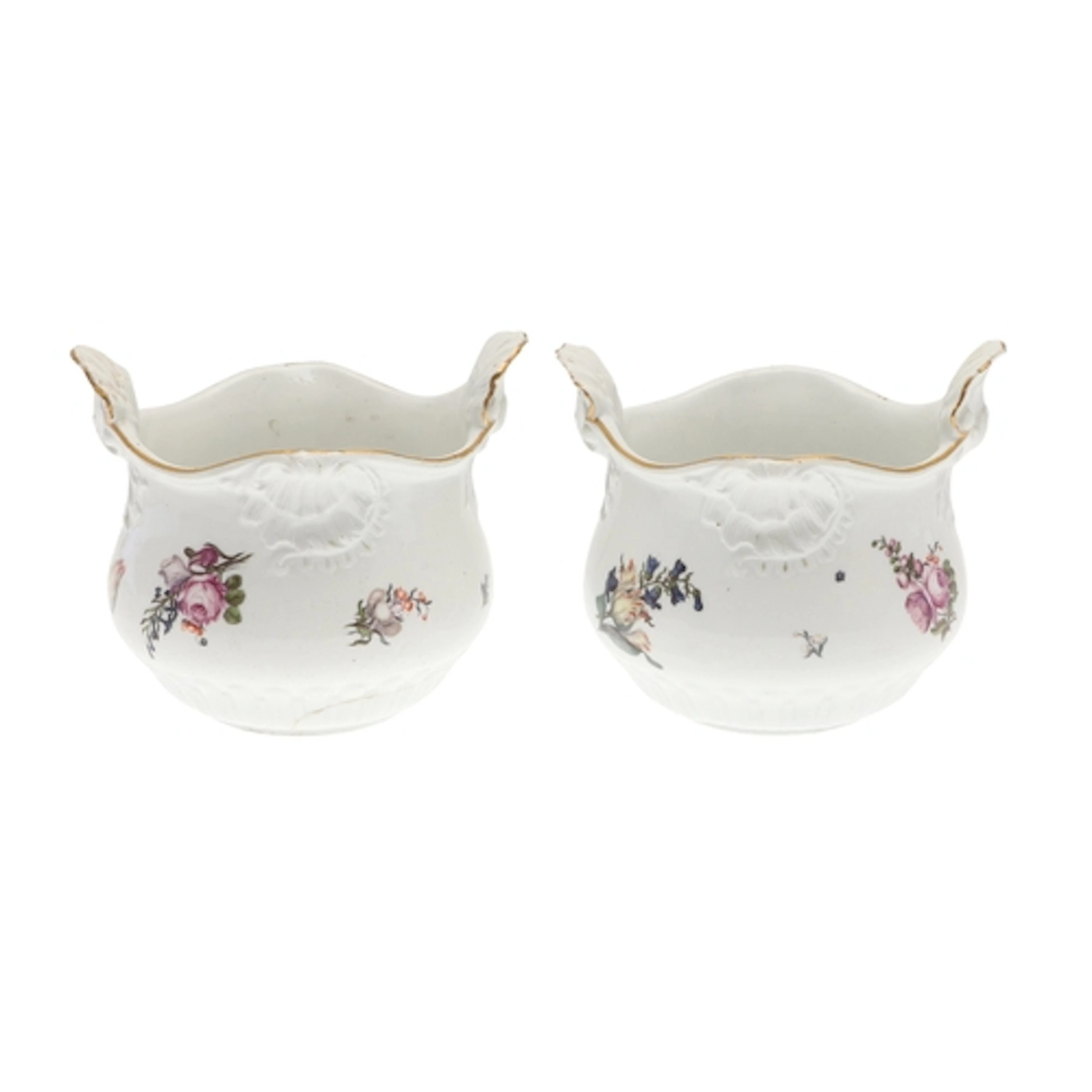 PAIR OF MEISSEN CACHE POTS. The cache pots painted with spra...