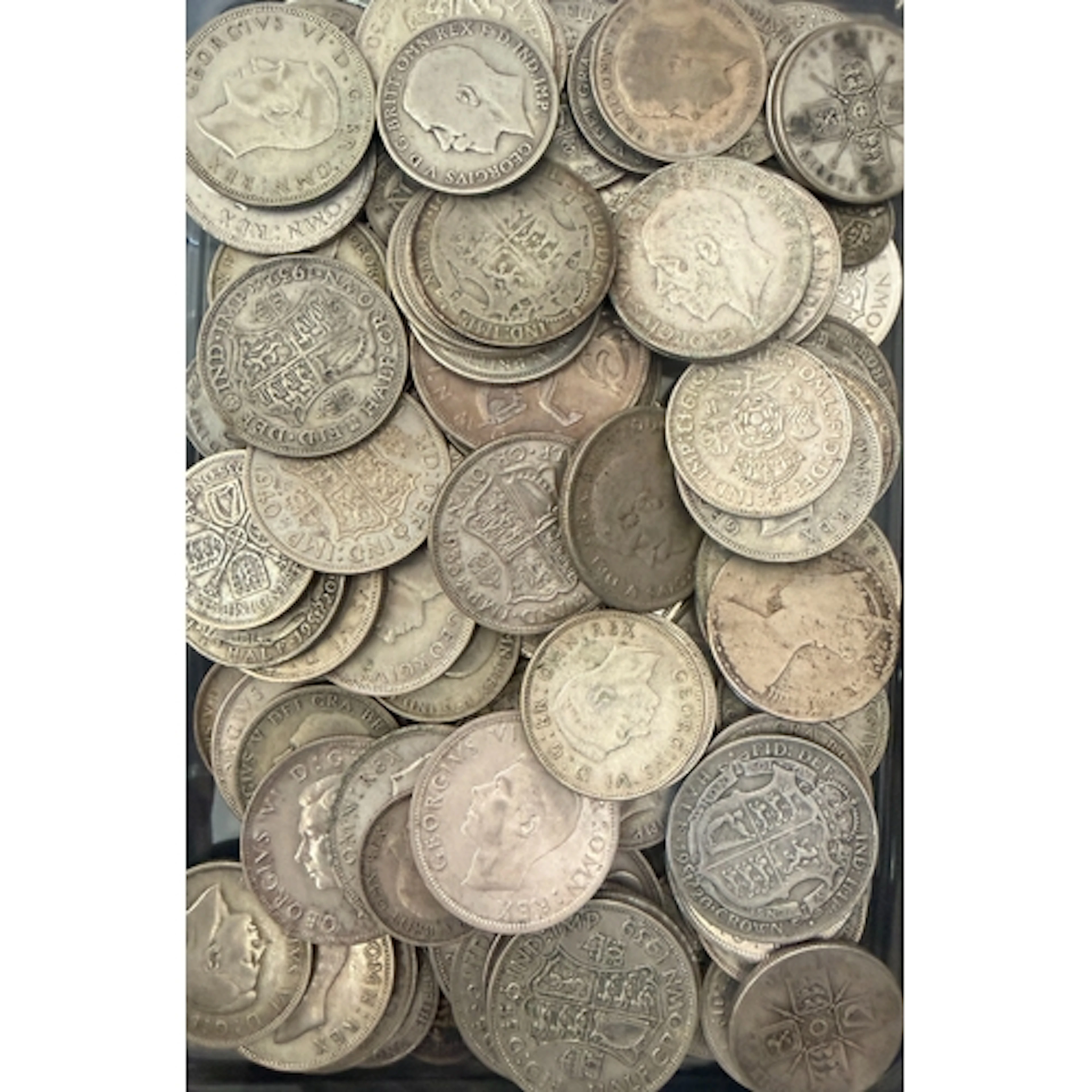 A collection of circulated UK pre-1947 silver coins, denomin...