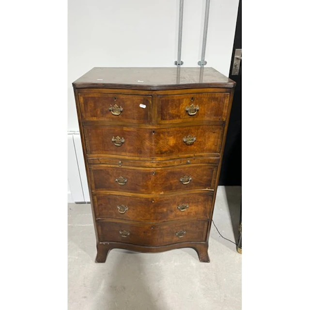 Mahogany serpentine fronted chest of two short over four lon...