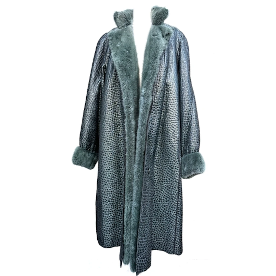 A Lisbeth Buchler, London, green overcoat with fur lining an...