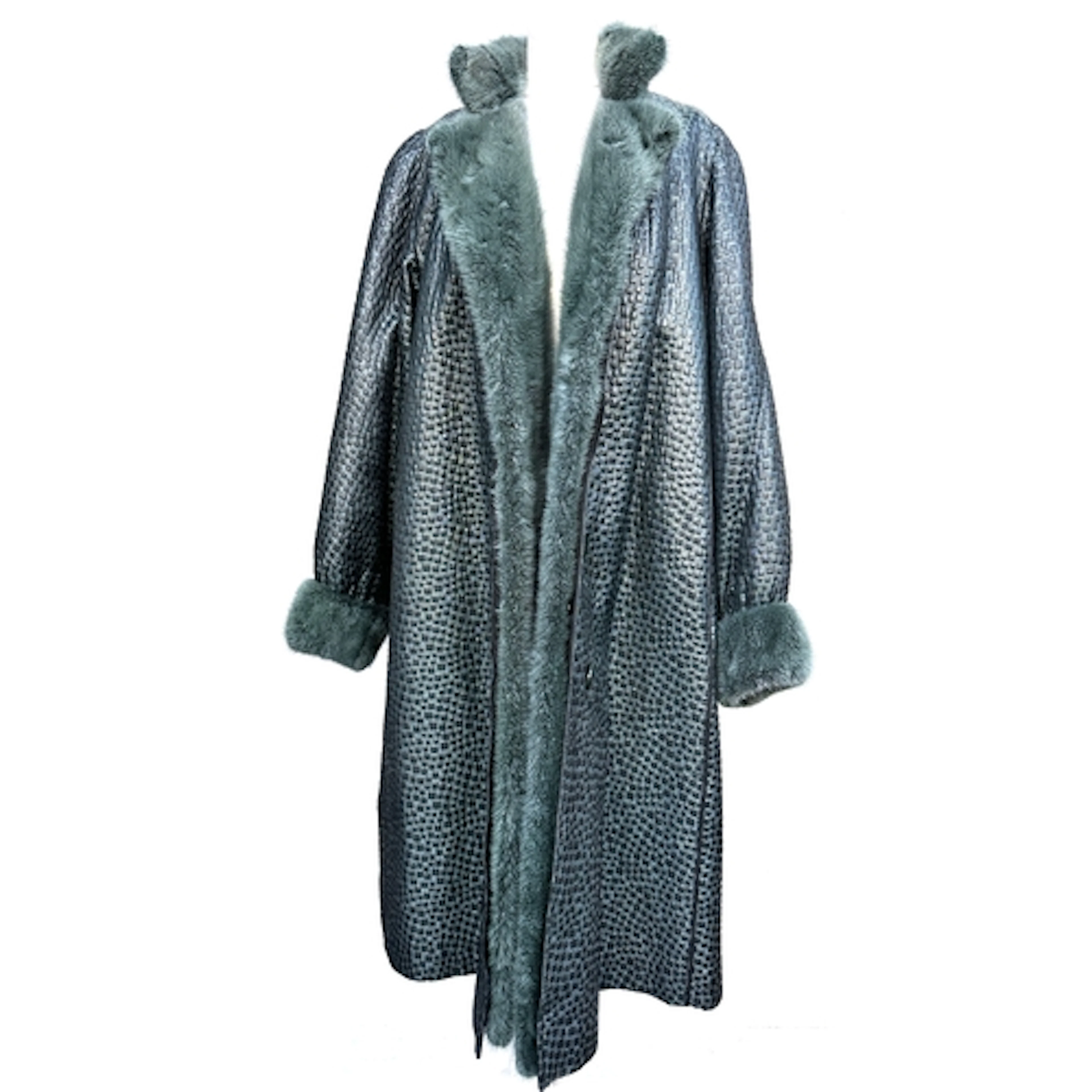 A Lisbeth Buchler, London, green overcoat with fur lining an...