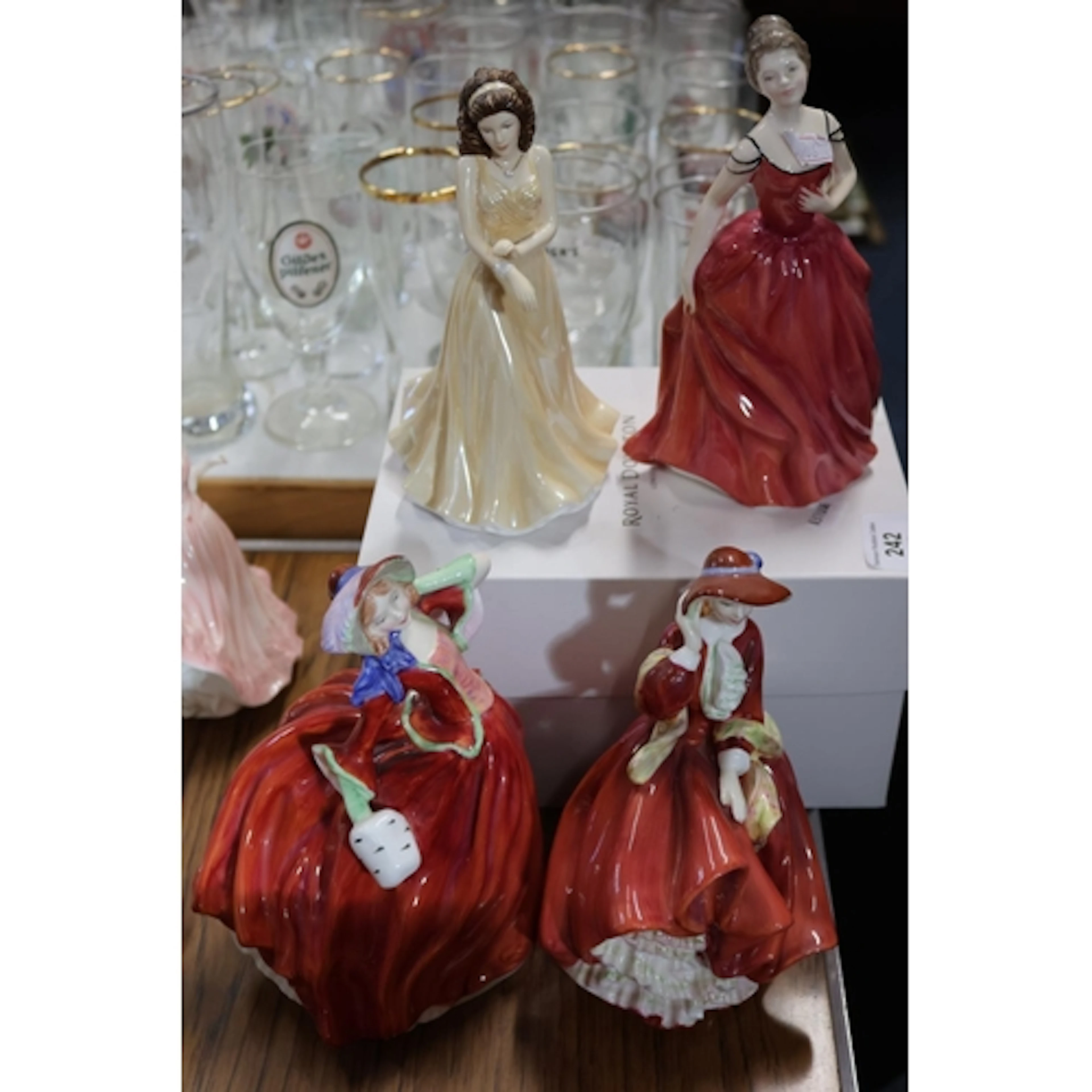 Four Royal Doulton figurines to include June Pearl, Autumn L...