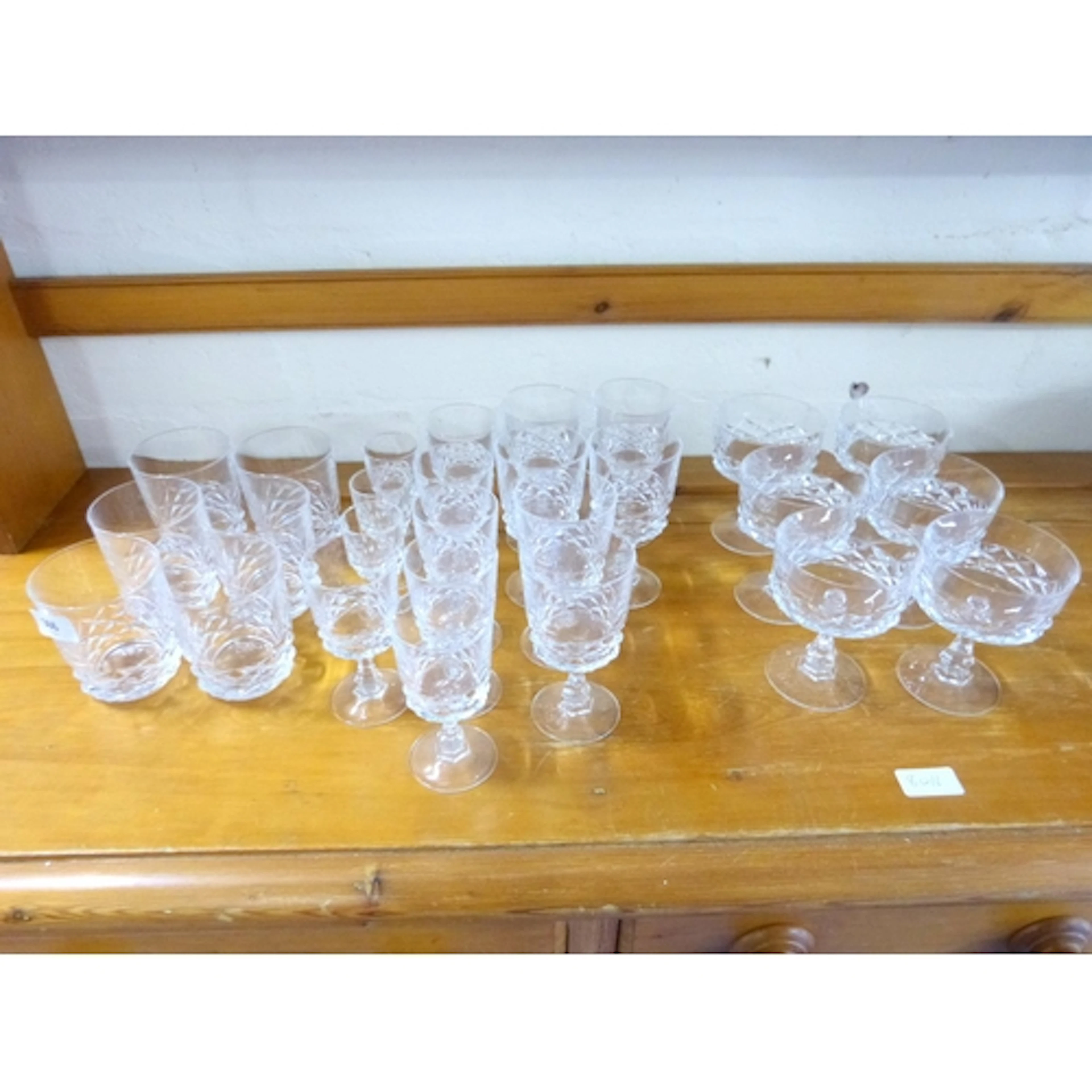 Large collection of crystal glasses including cranberry glas...