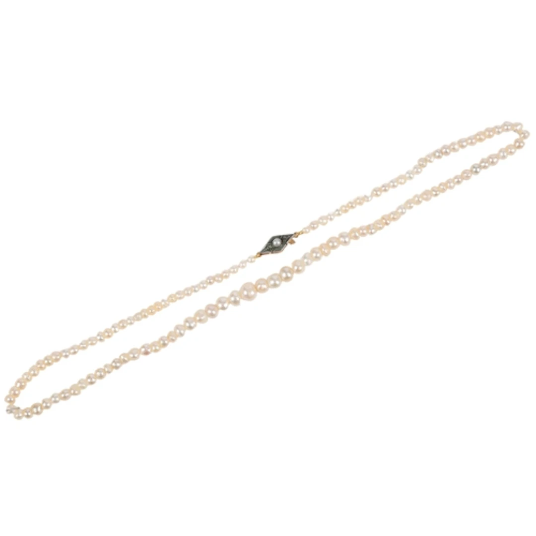 A natural pearl necklace, early 20th century, composed of a ...