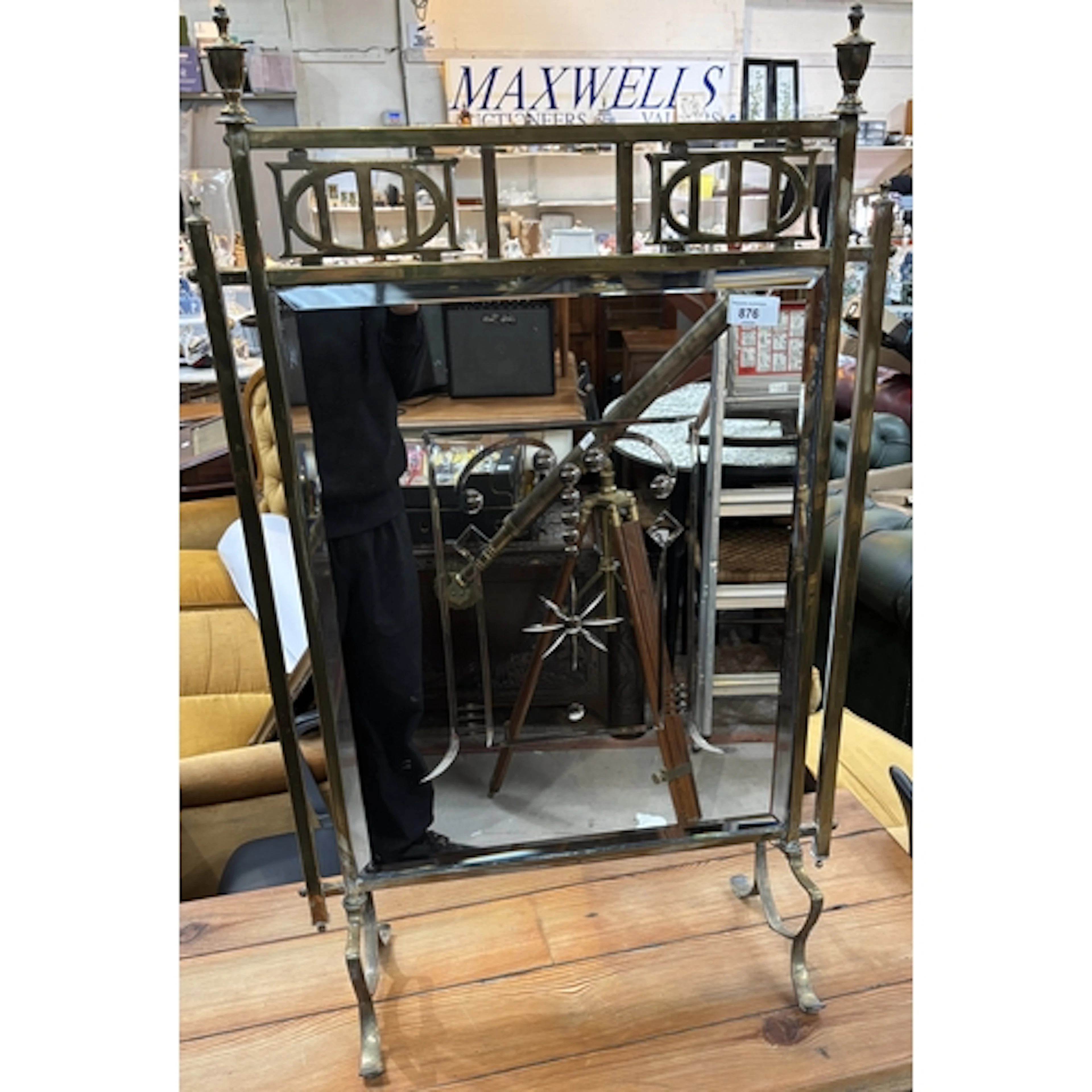 A late 19th/early 20th century brass and mirrored fire scree...