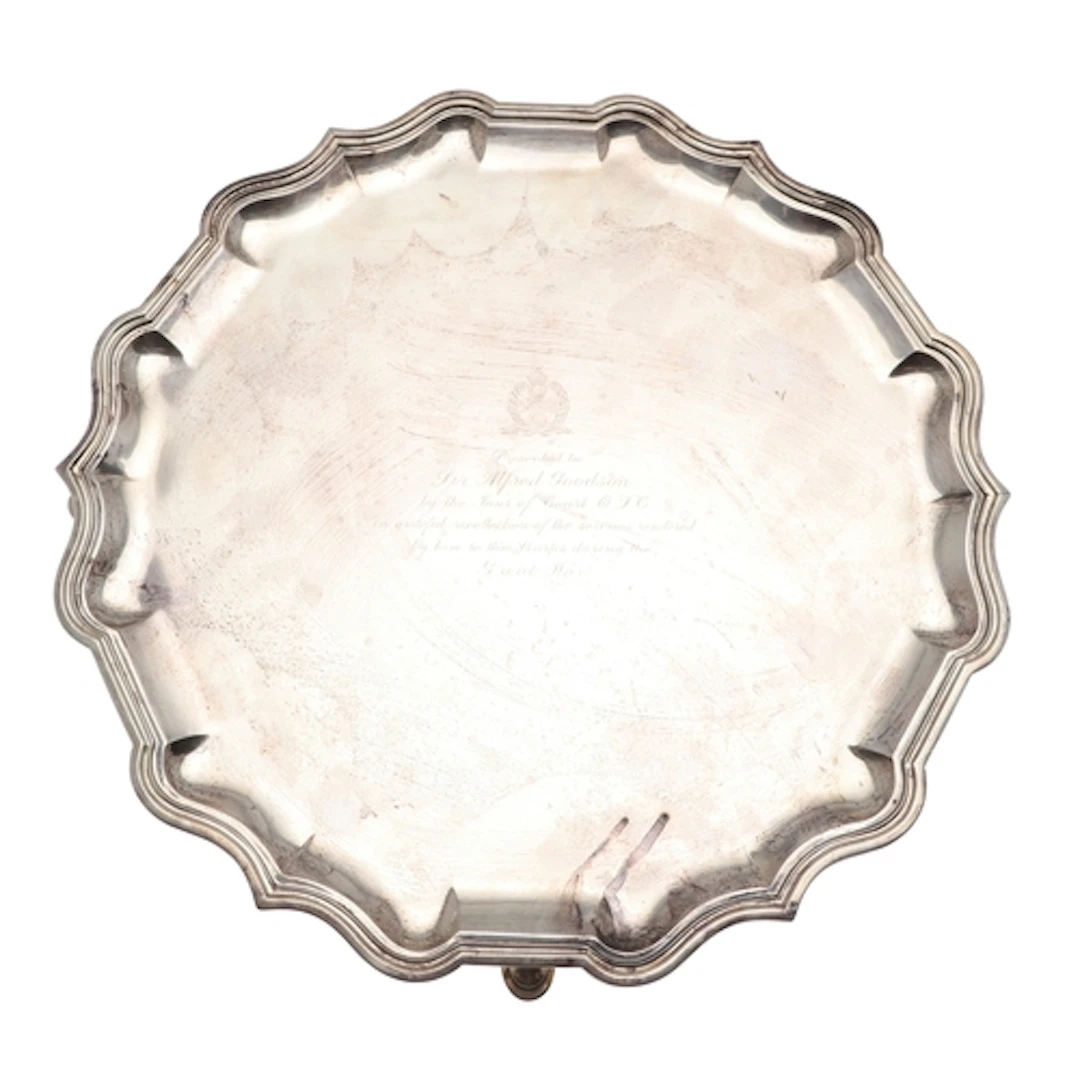 AN EARLY 20TH CENTURY SILVER SALVER. Of round form with piec...