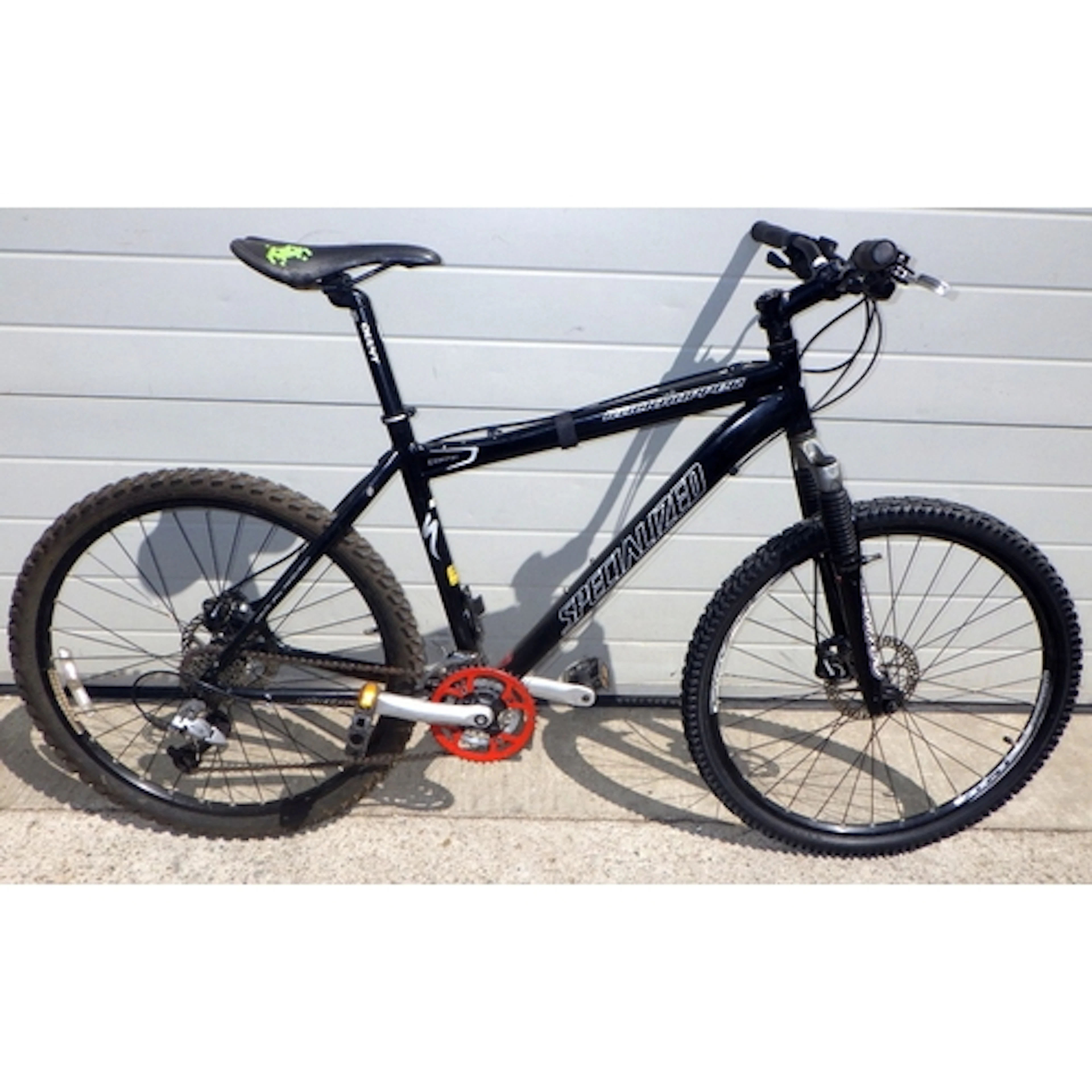 A black Specialized Giant Rock Hopper mountain bike, 19inch ...