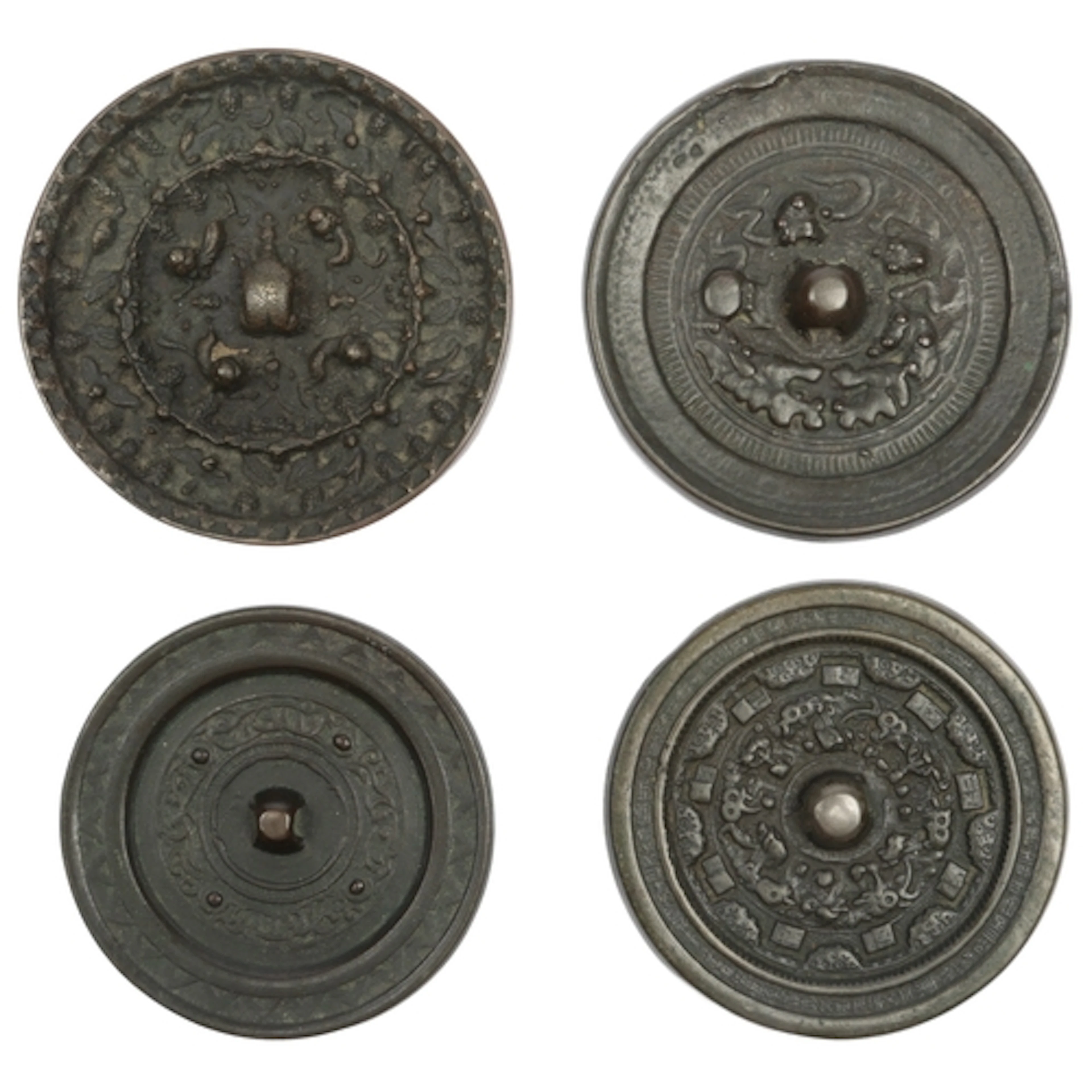 Four Chinese bronze mirrors, Song dynasty or later, each rev...