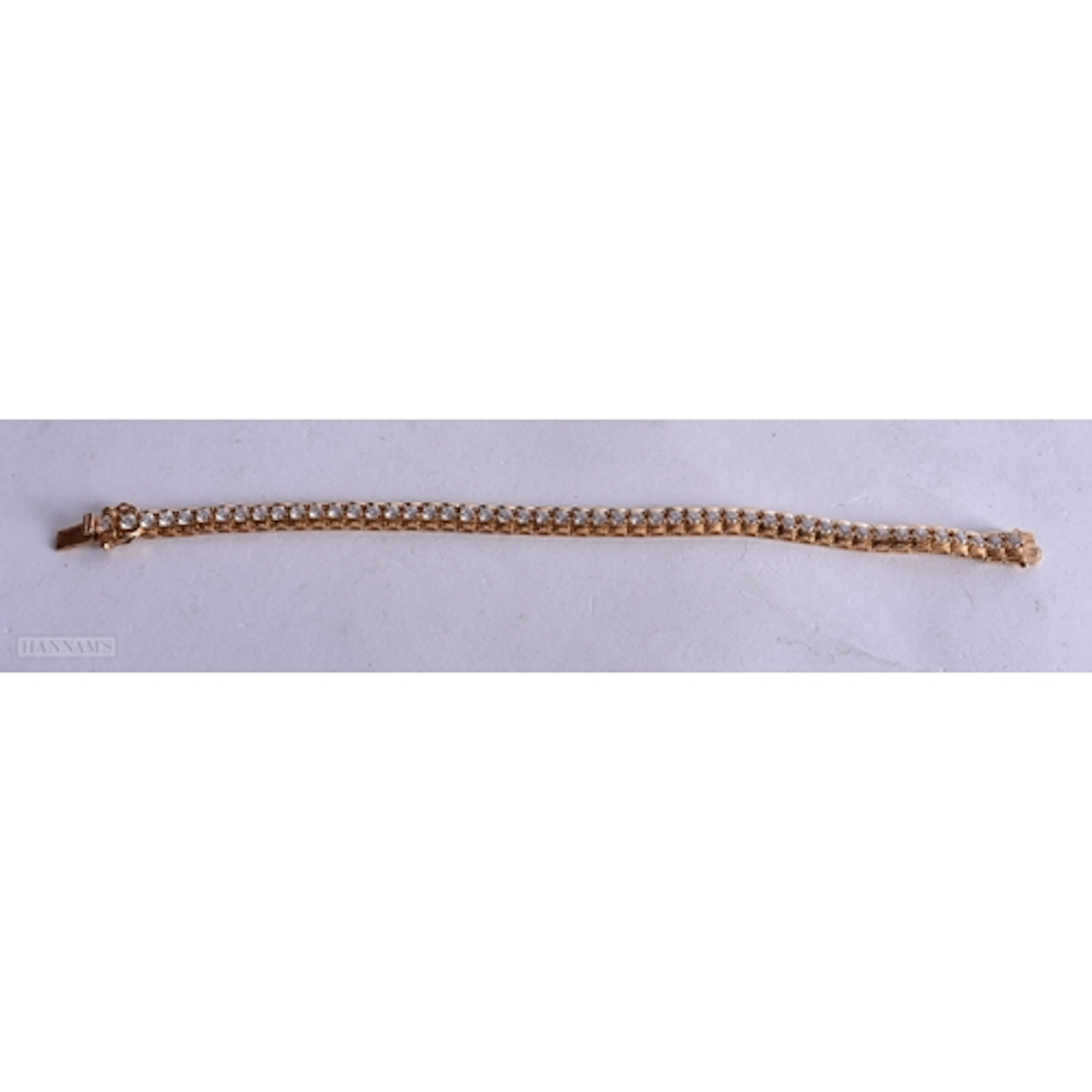 A SILVER GILT CZ TENNIS BRACELET marked 925. 19.5 cm. 17.6 g...